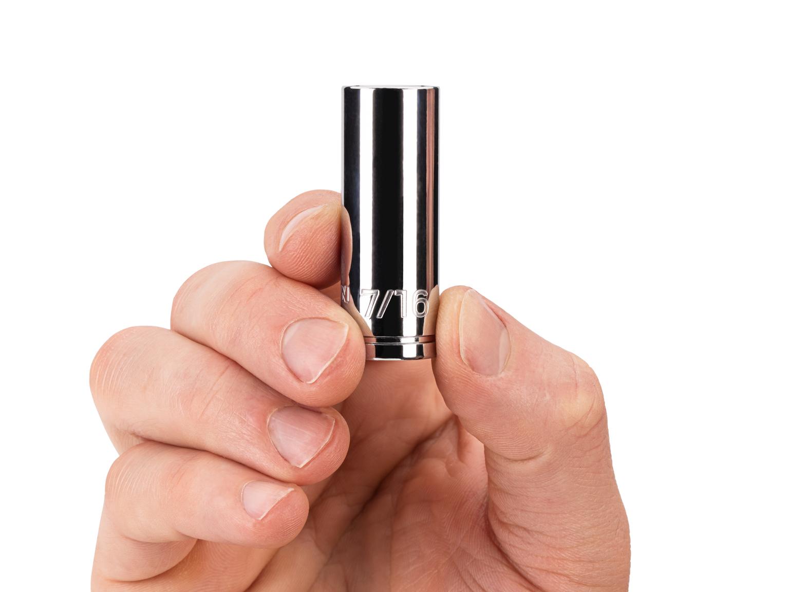 Person holding Tekton 7/16 inch hand drive 6-point socket. Item #SHD14011