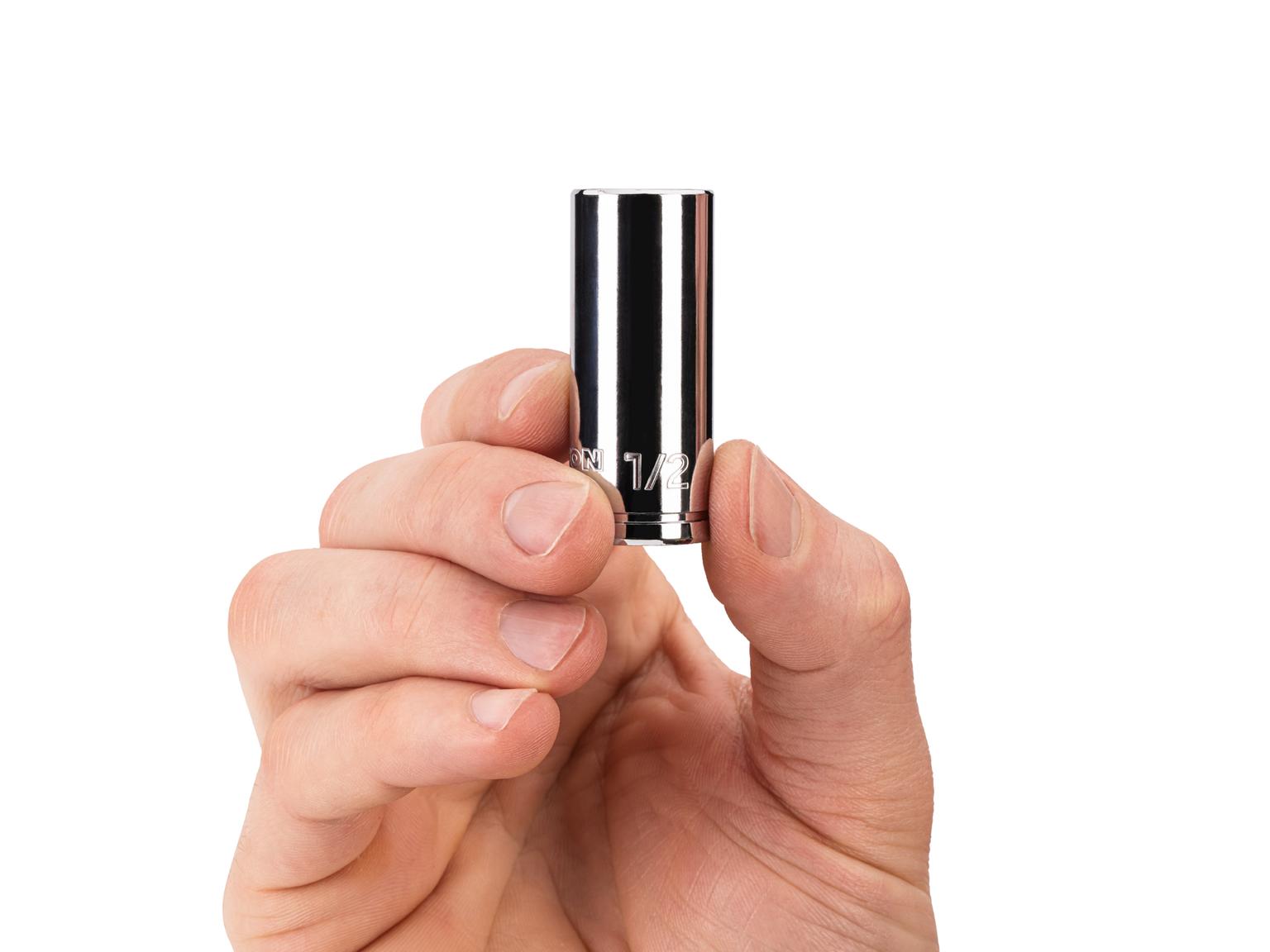 Person holding Tekton 1/2 inch hand drive 6-point socket. Item #SHD14013
