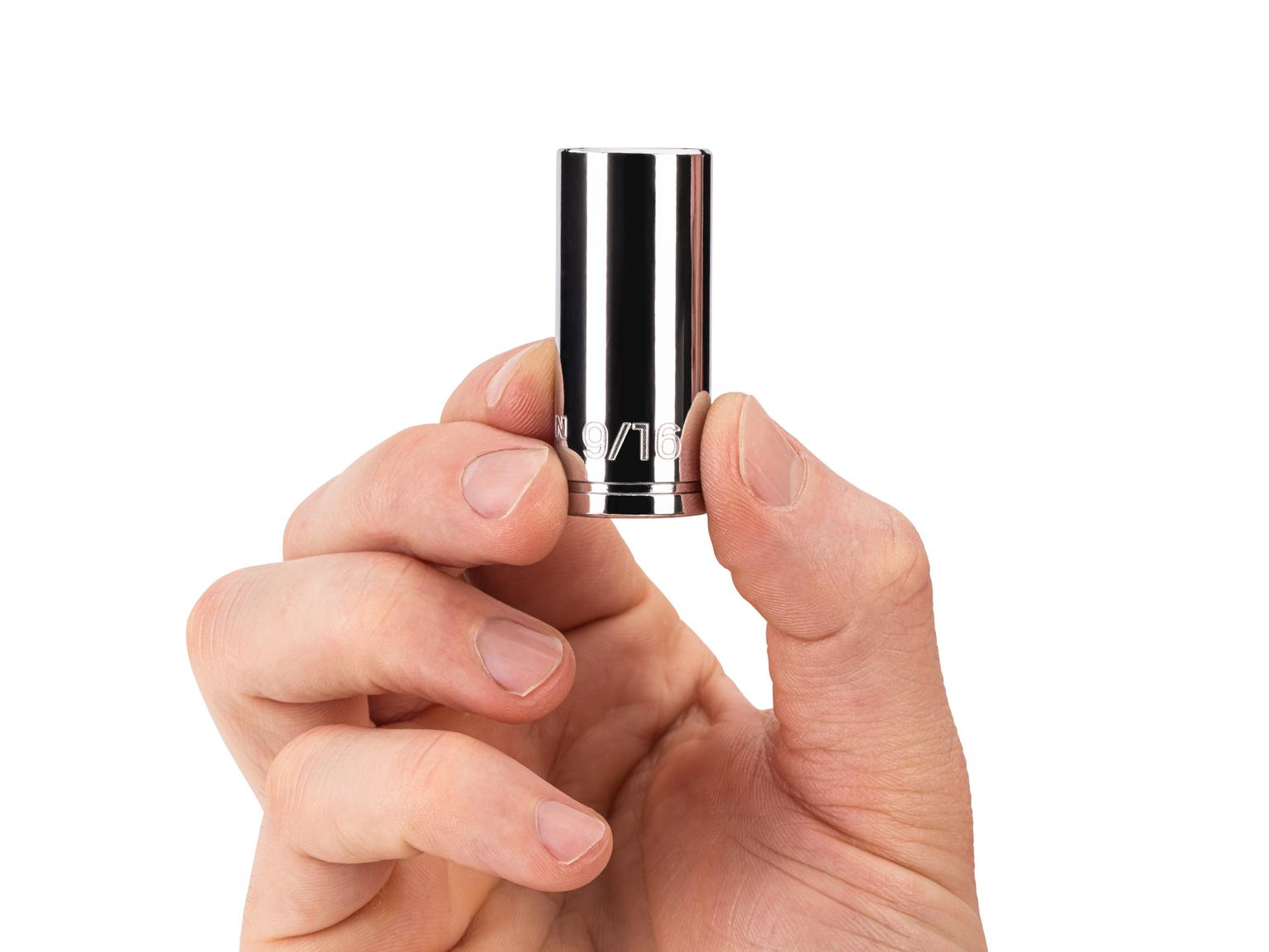 Person holding Tekton 9/16 inch hand drive 6-point socket. Item #SHD14014