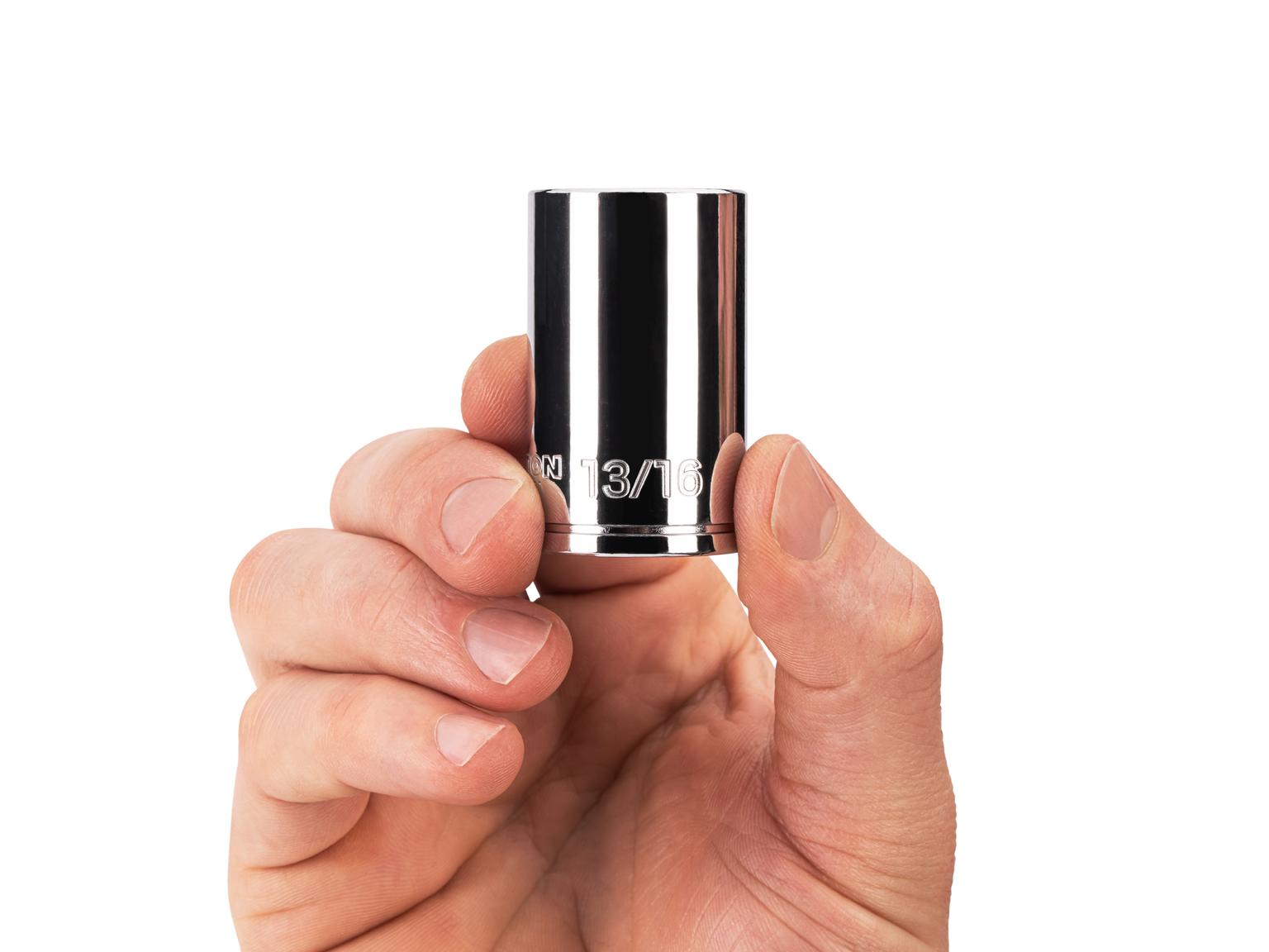 Person holding Tekton 13/16 inch hand drive 6-point socket. Item #SHD14021