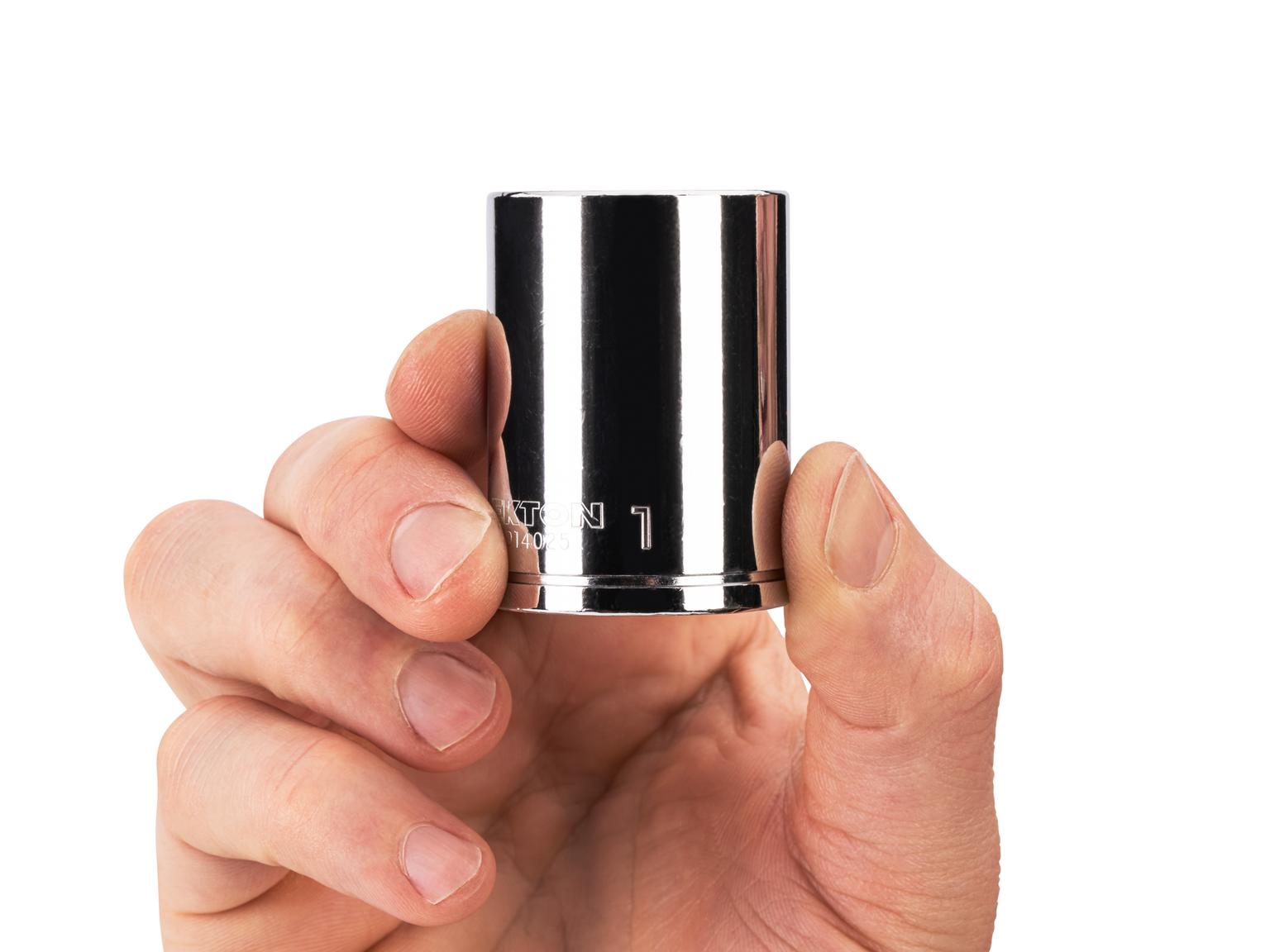 Person holding Tekton 1 inch hand drive 6-point socket. Item #SHD14025
