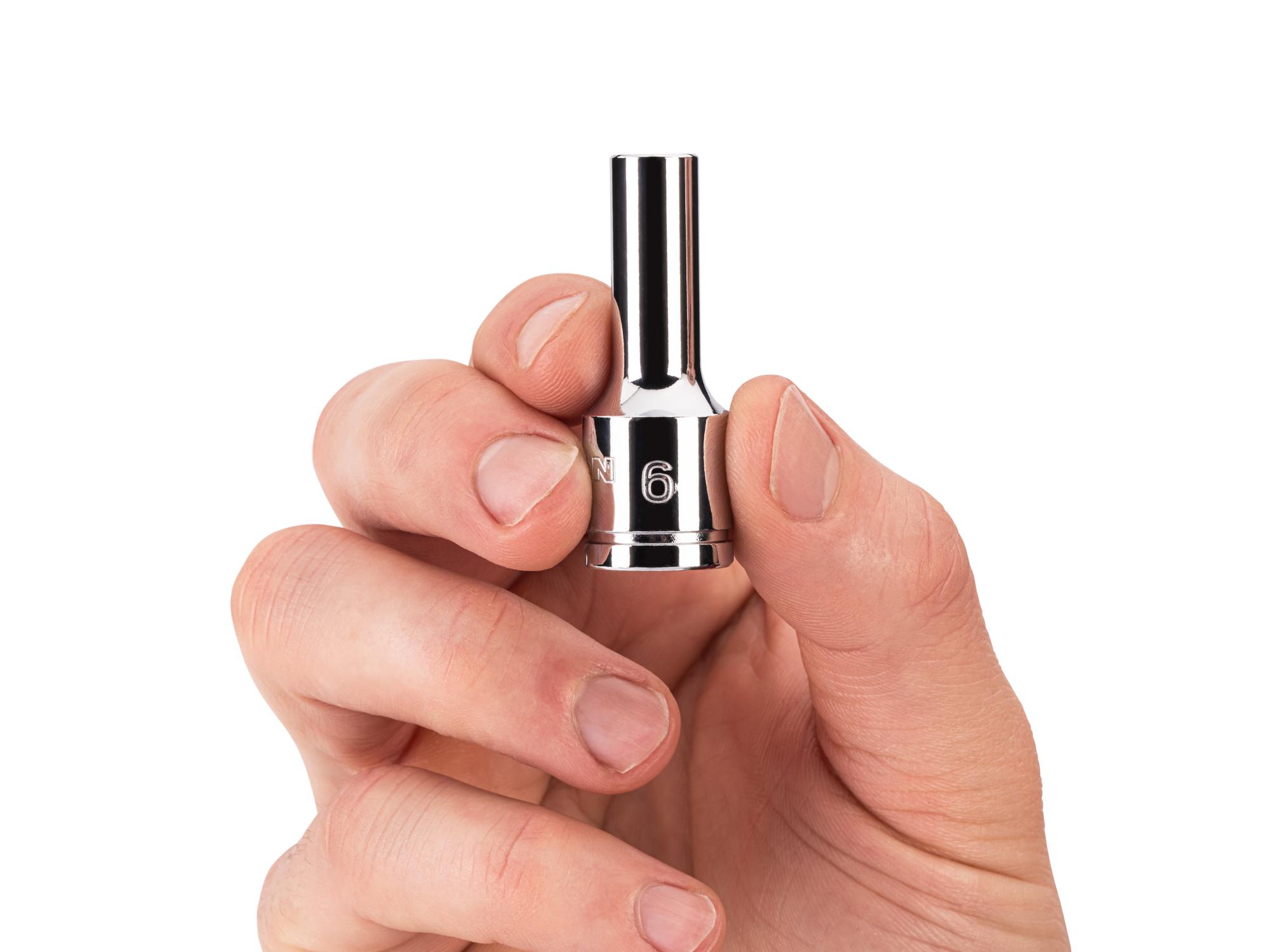 Person holding Tekton hand drive 6-point socket. Item #SHD14106