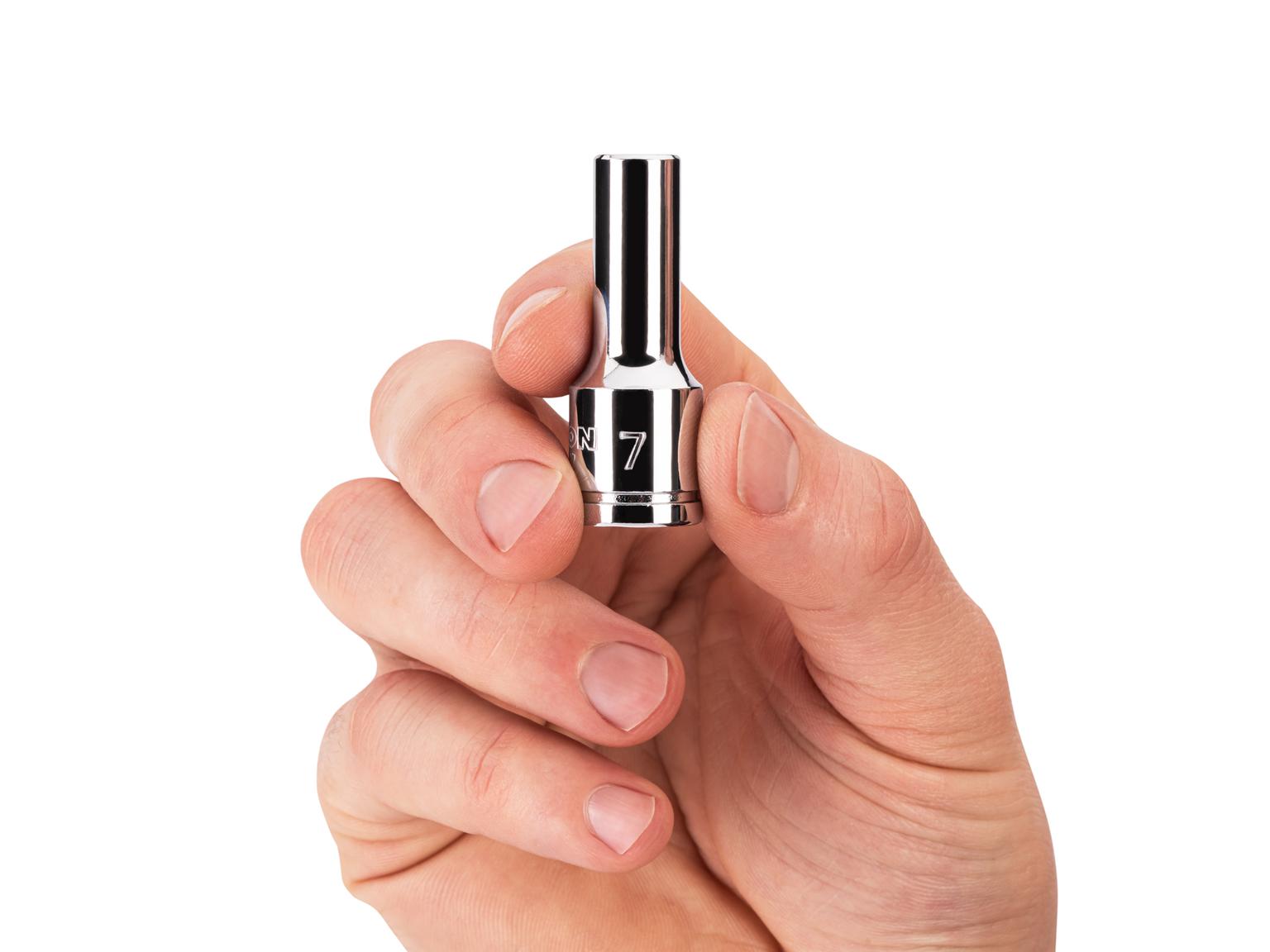 Person holding Tekton 7 millimeter hand drive 6-point socket. Item #SHD14107