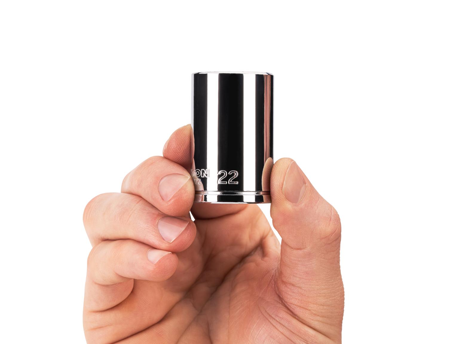 Person holding Tekton 22 millimeter hand drive 6-point socket. Item #SHD14122