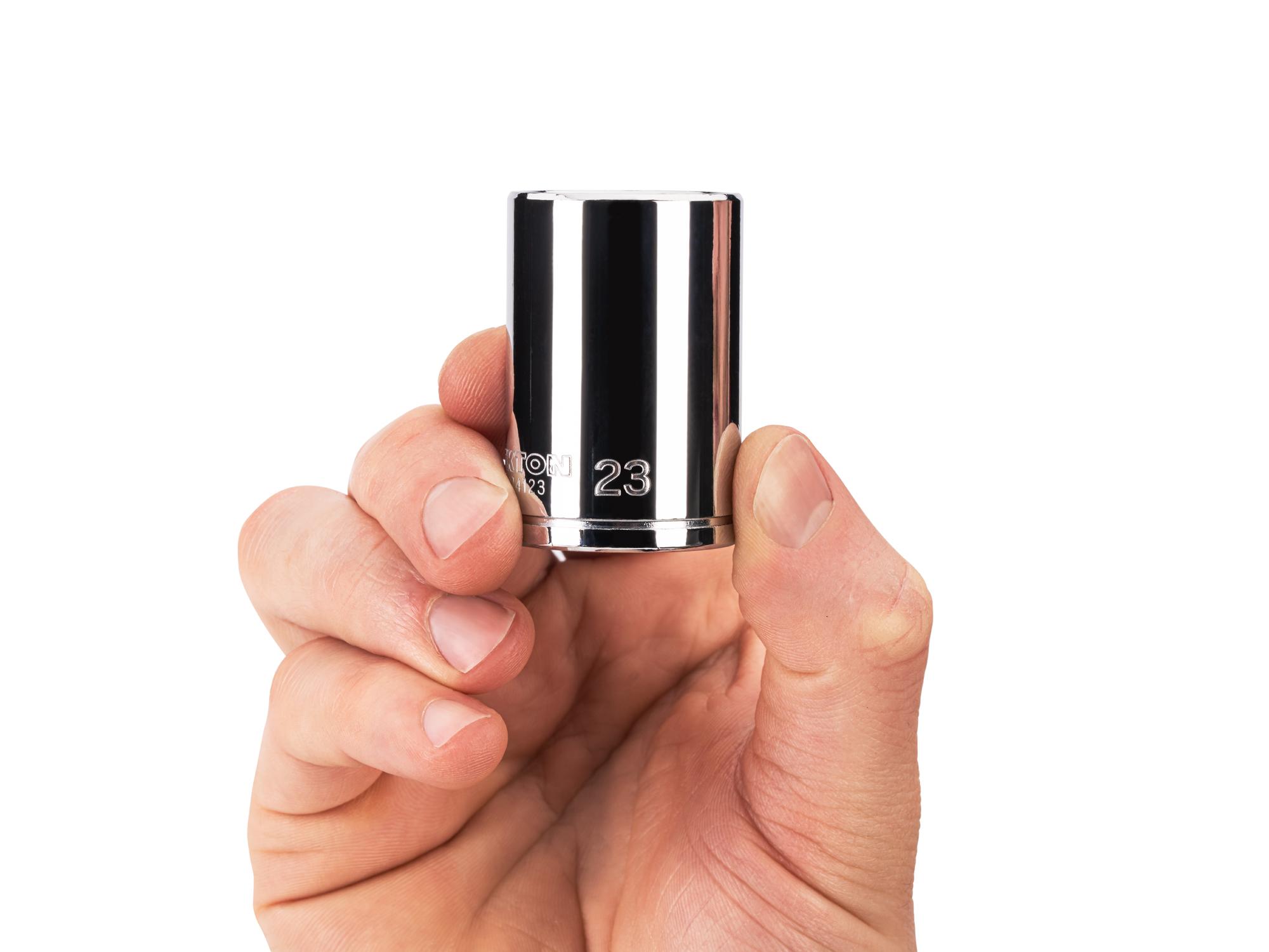 Person holding Tekton hand drive 6-point socket. Item #SHD14123
