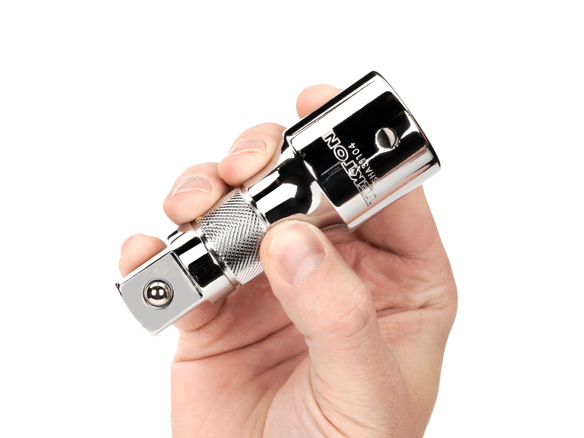 Person holding Tekton 4 inch hand drive accessory. Item #SHA31104