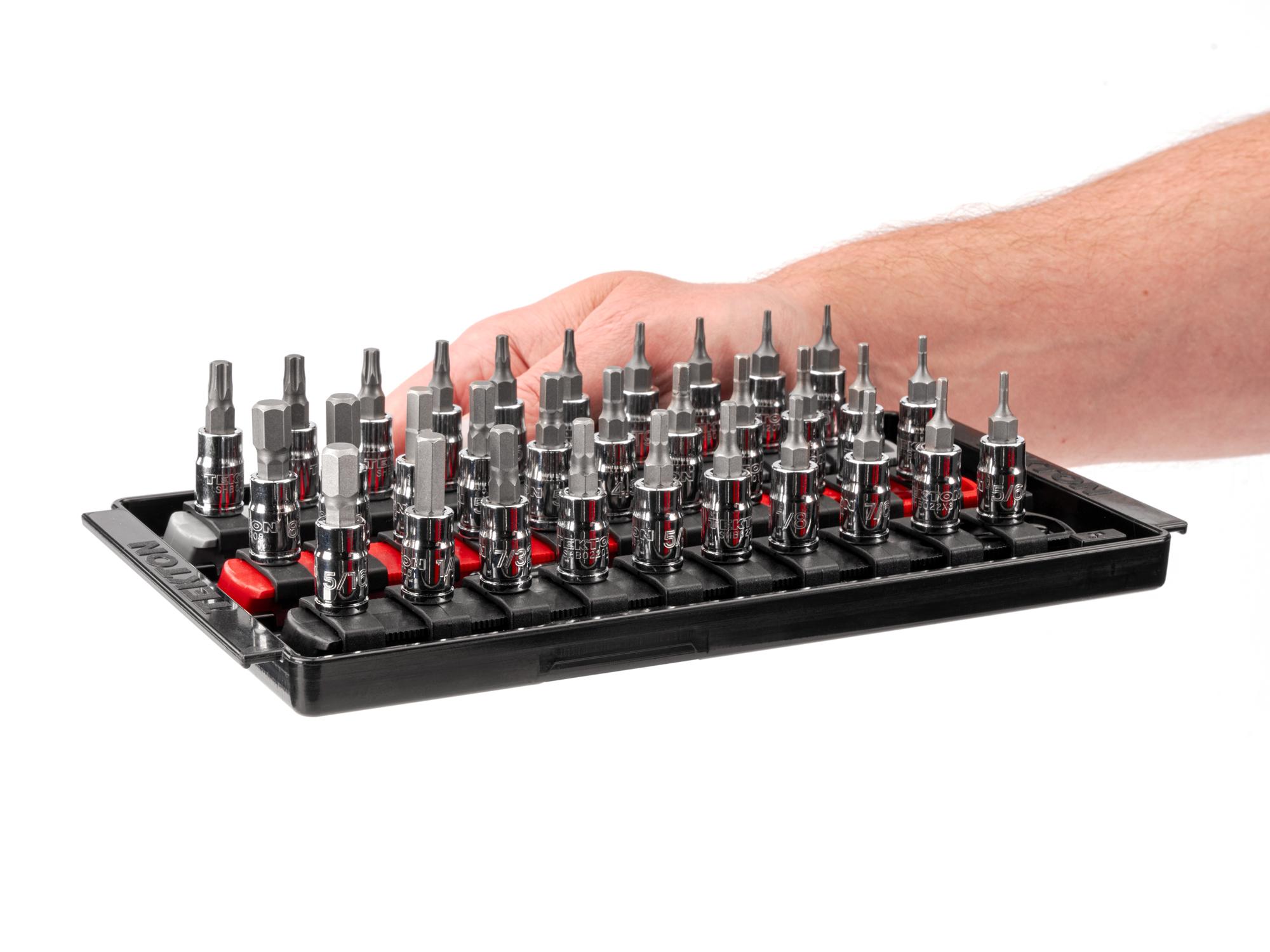 Person holding Tekton rail and tray hand drive bit socket set. Item #SHB90204
