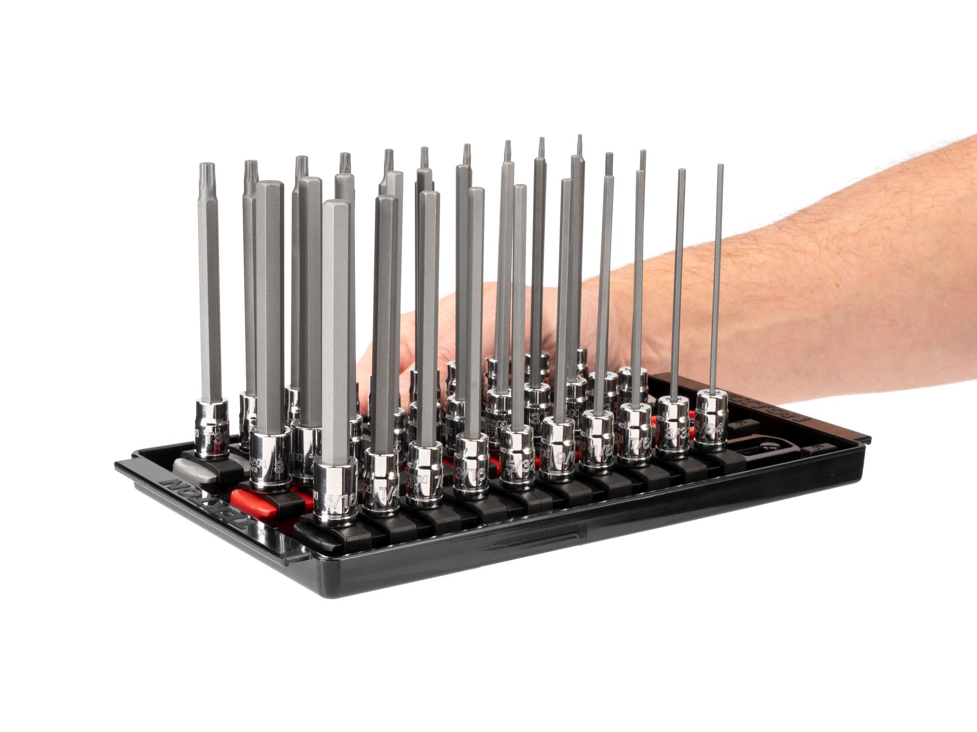 Person holding Tekton rail and tray hand drive bit socket set. Item #SHB90205