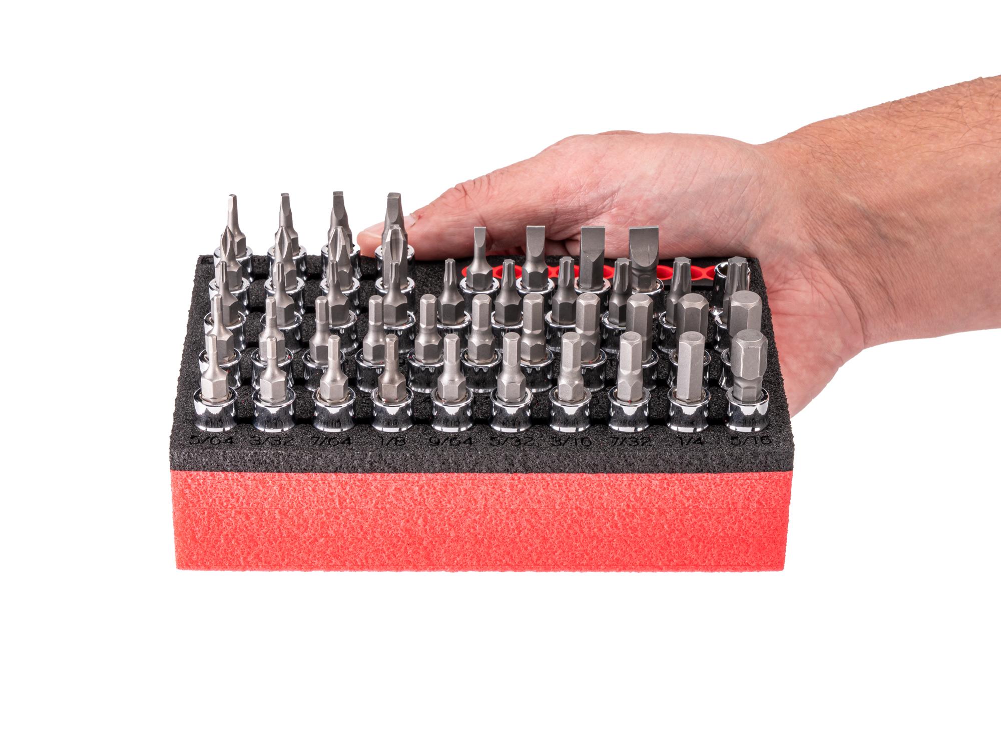 Person holding Tekton foam hand drive bit socket set. Item #SHB90800