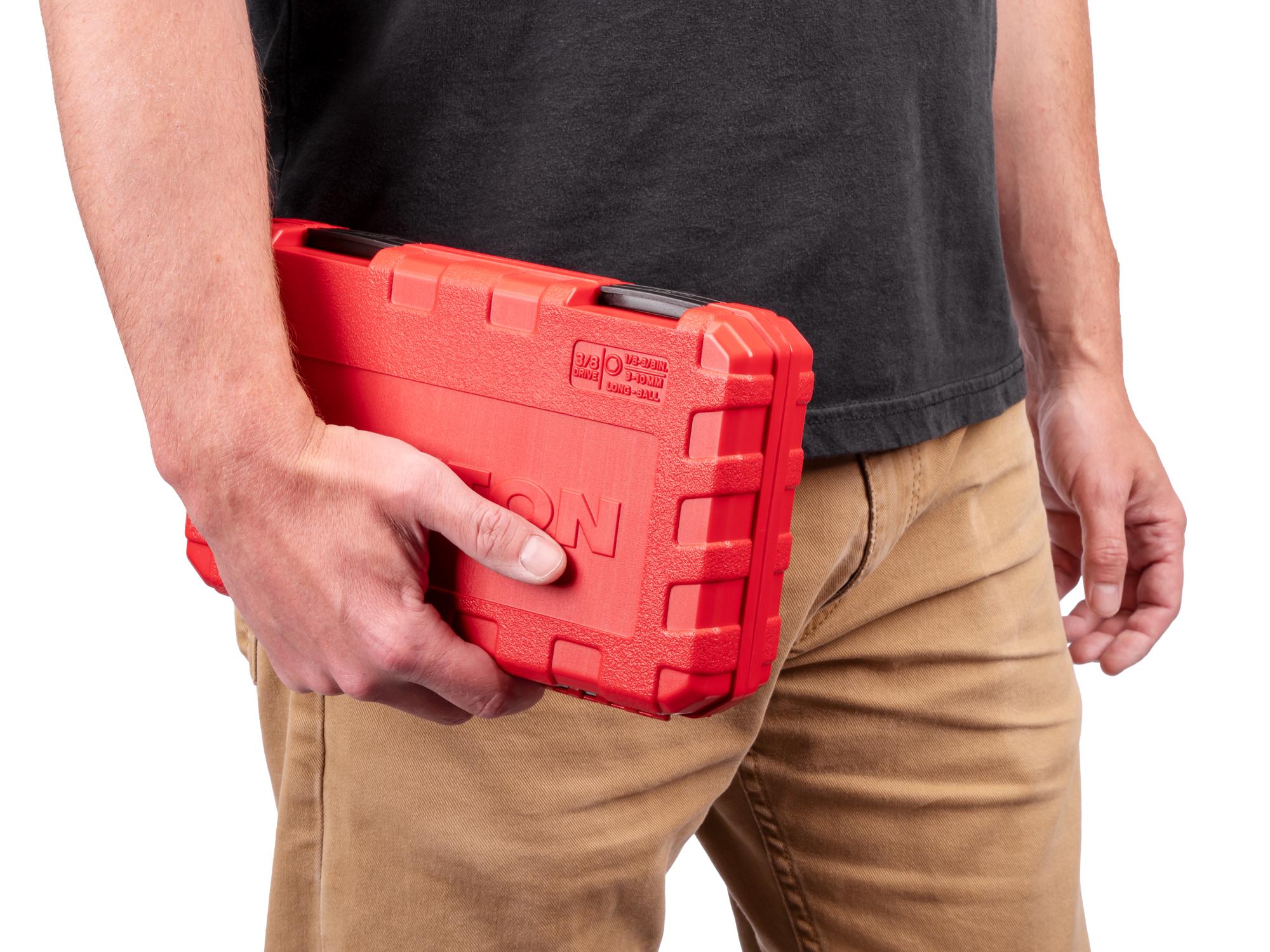 Person holding Tekton case hand drive bit socket set. Item #SHB91321