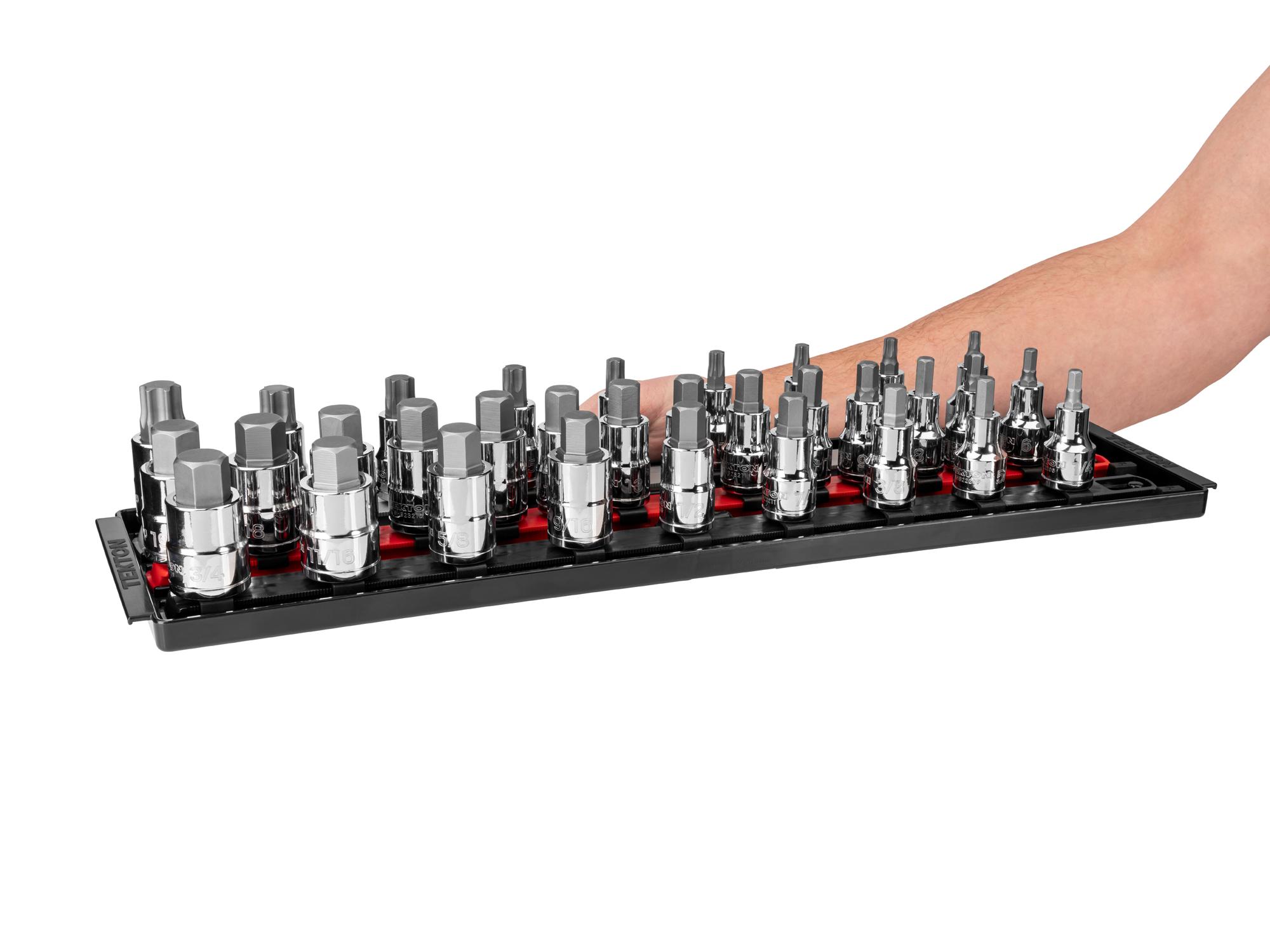 Person holding Tekton rail and tray hand drive bit socket set. Item #SHB92203