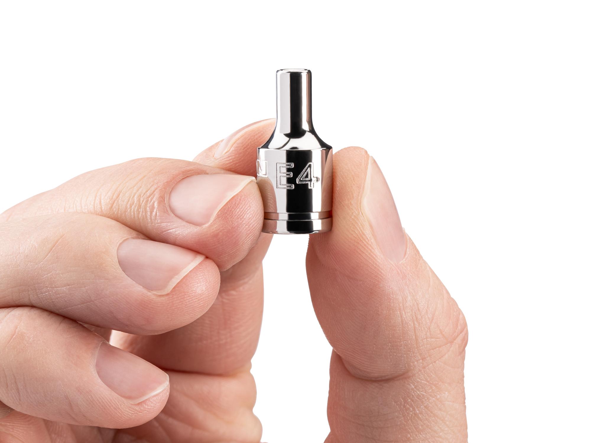 Person holding Tekton hand drive external star socket. Item #SHD02404