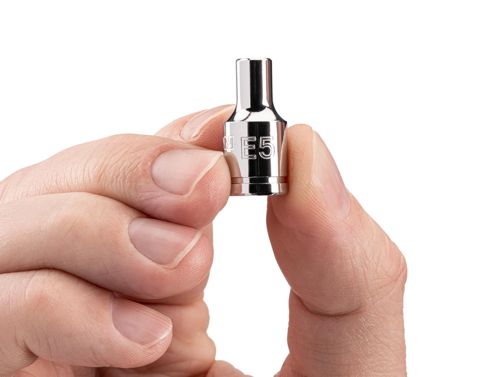 Person holding Tekton hand drive external star socket. Item #SHD02405