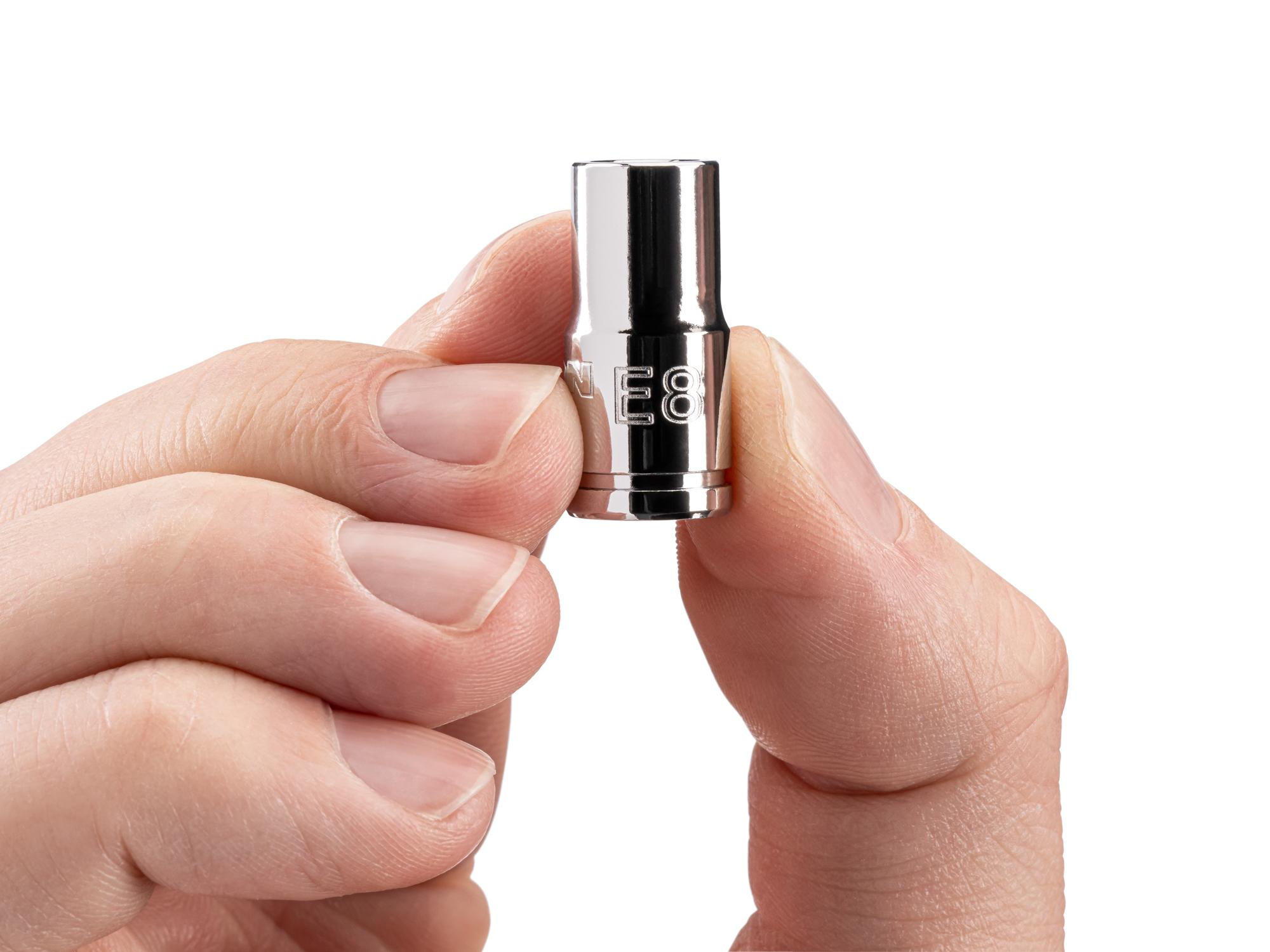 Person holding Tekton hand drive external star socket. Item #SHD02408