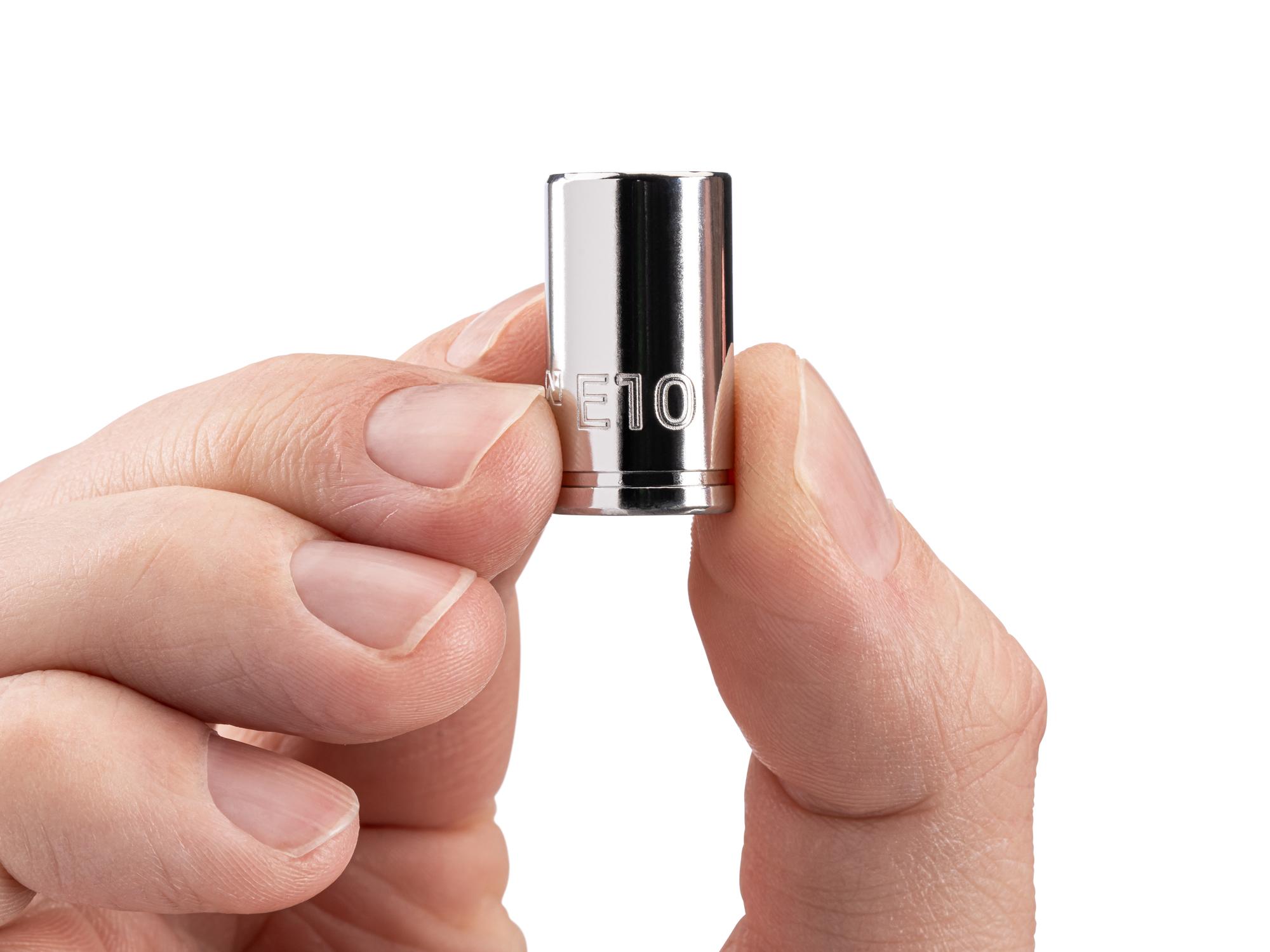 Person holding Tekton hand drive external star socket. Item #SHD02410