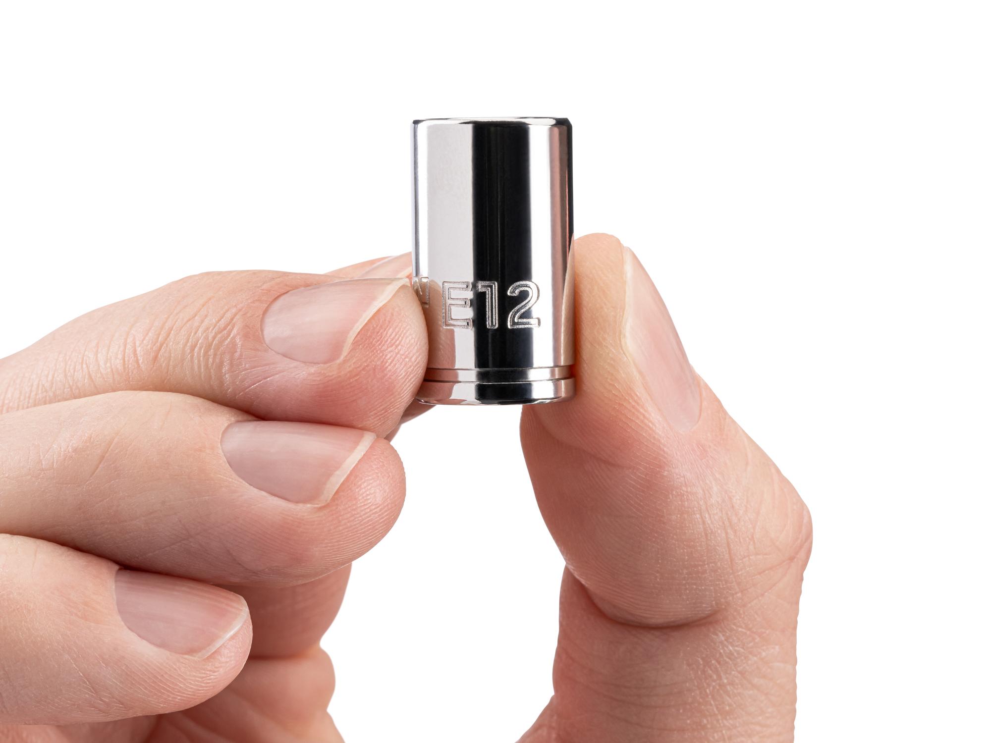 Person holding Tekton hand drive external star socket. Item #SHD02412