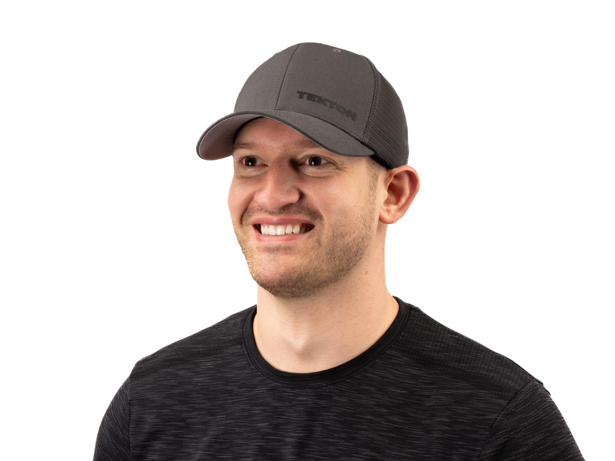 A person smiling and wearing a gray Tekton hat. Item #APG31006.