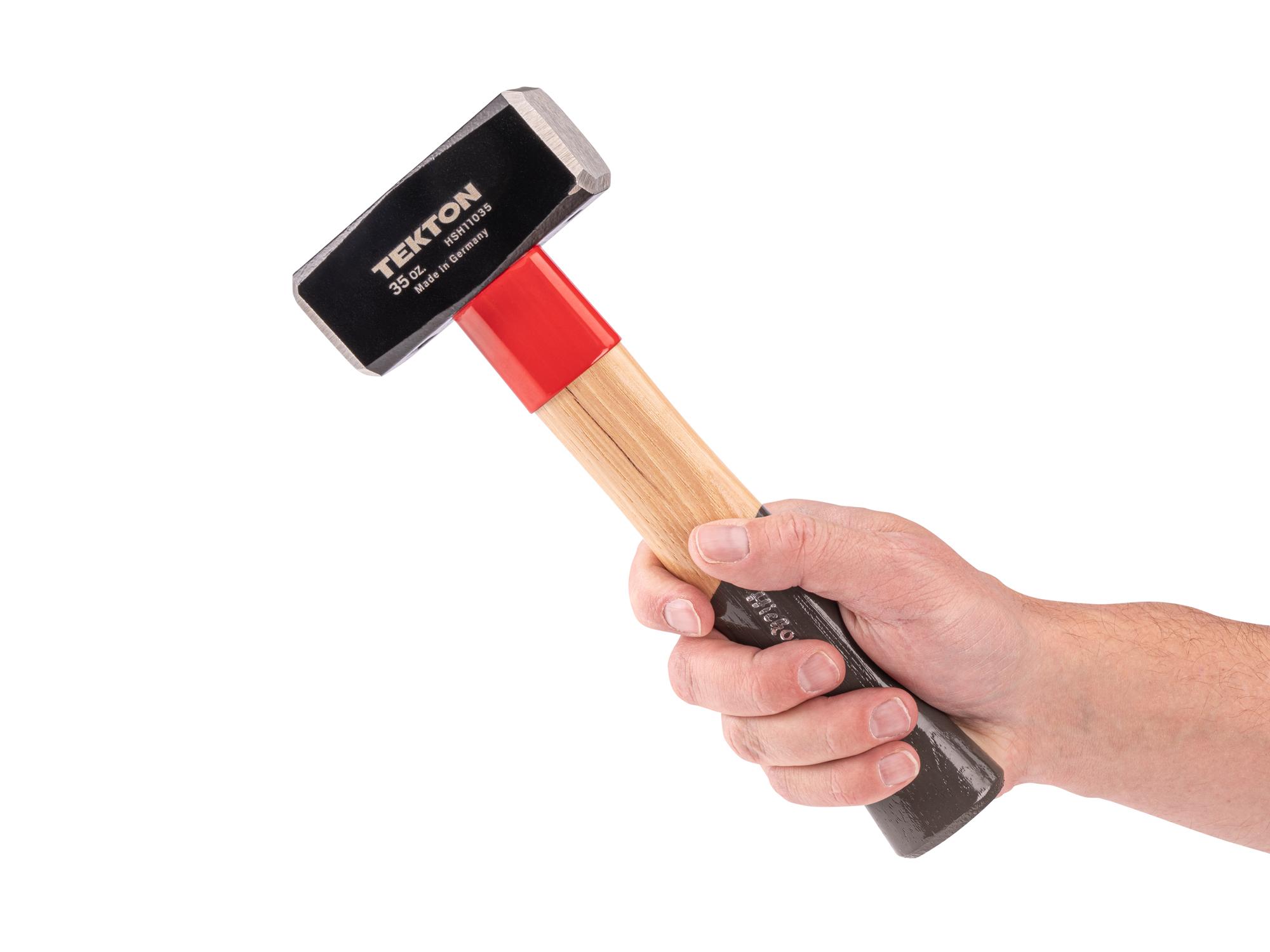 Person holding Tekton heavy hammer. Item #HSH11035