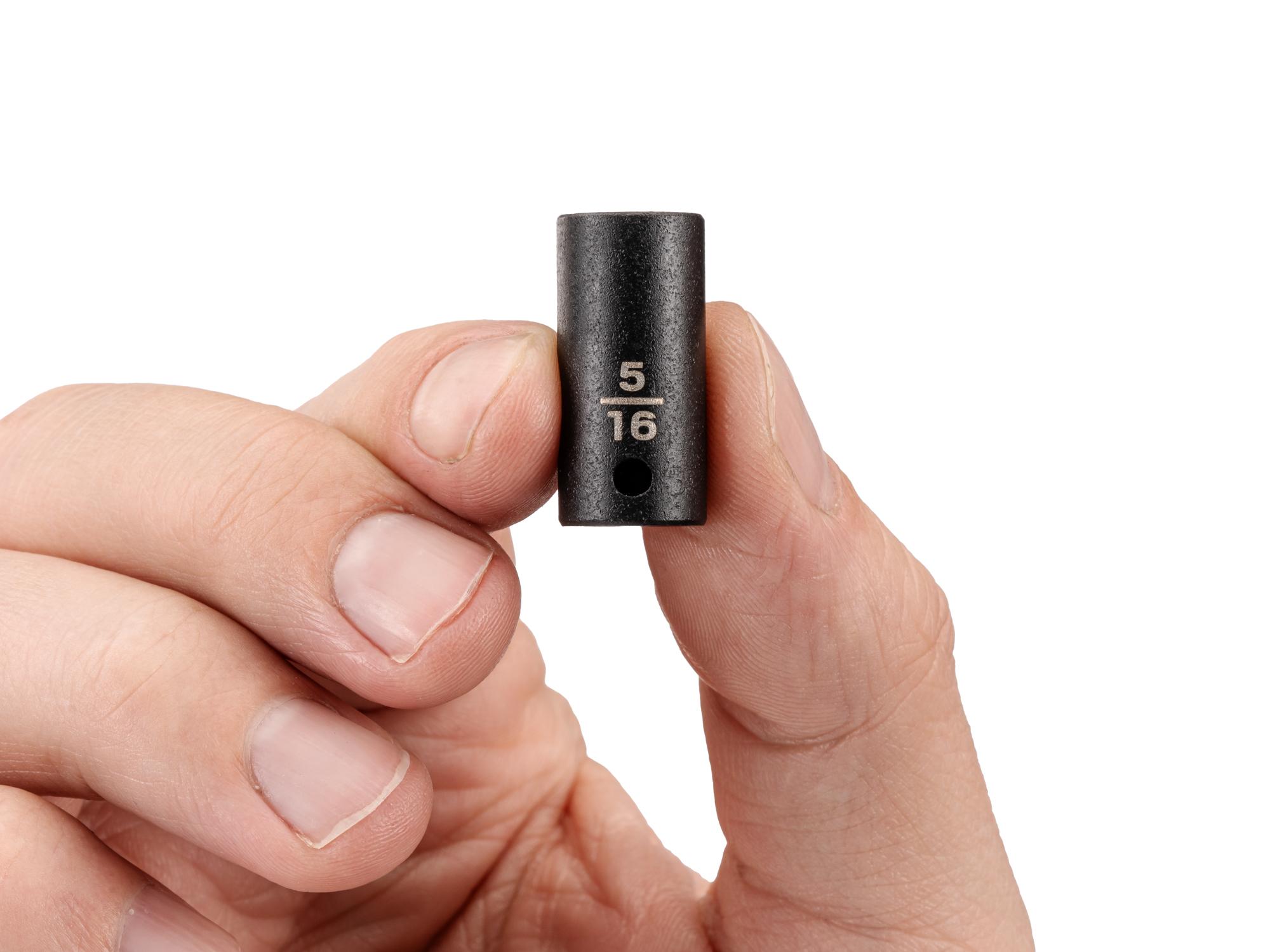 Person holding Tekton impact drive 6-point socket. Item #SID02008