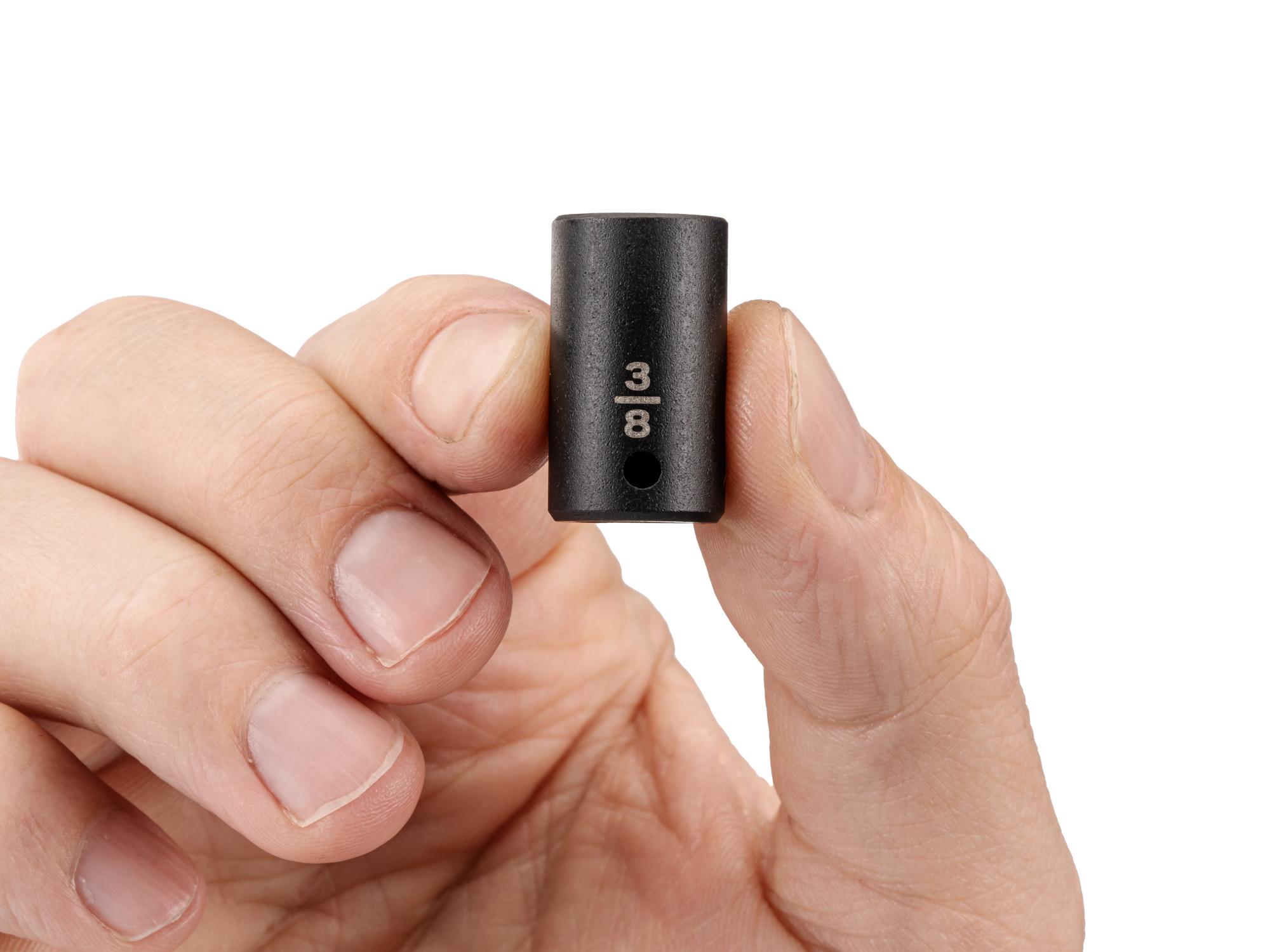 Person holding Tekton impact drive 6-point socket. Item #SID02010