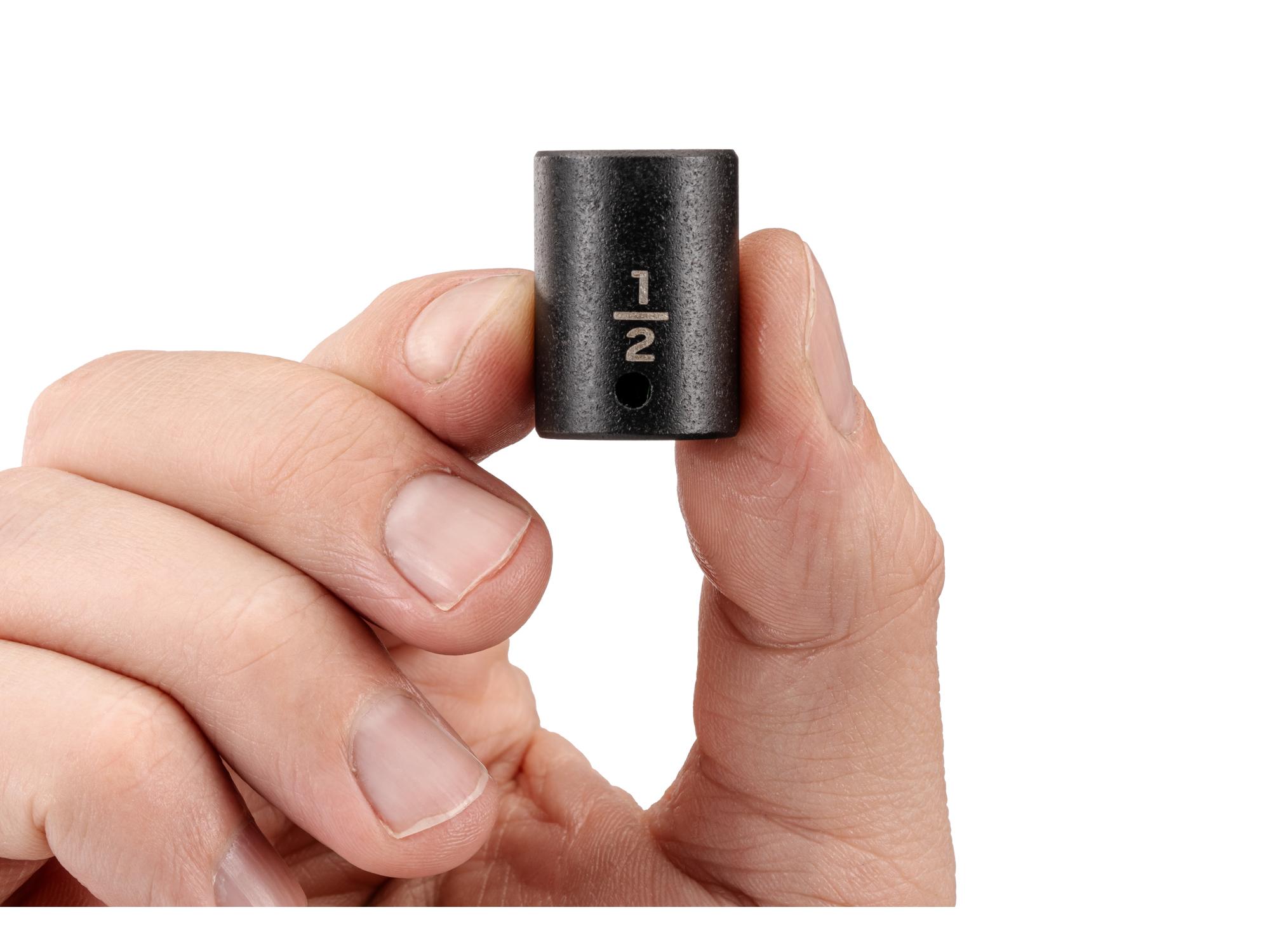 Person holding Tekton impact drive 12-point socket. Item #SID02213