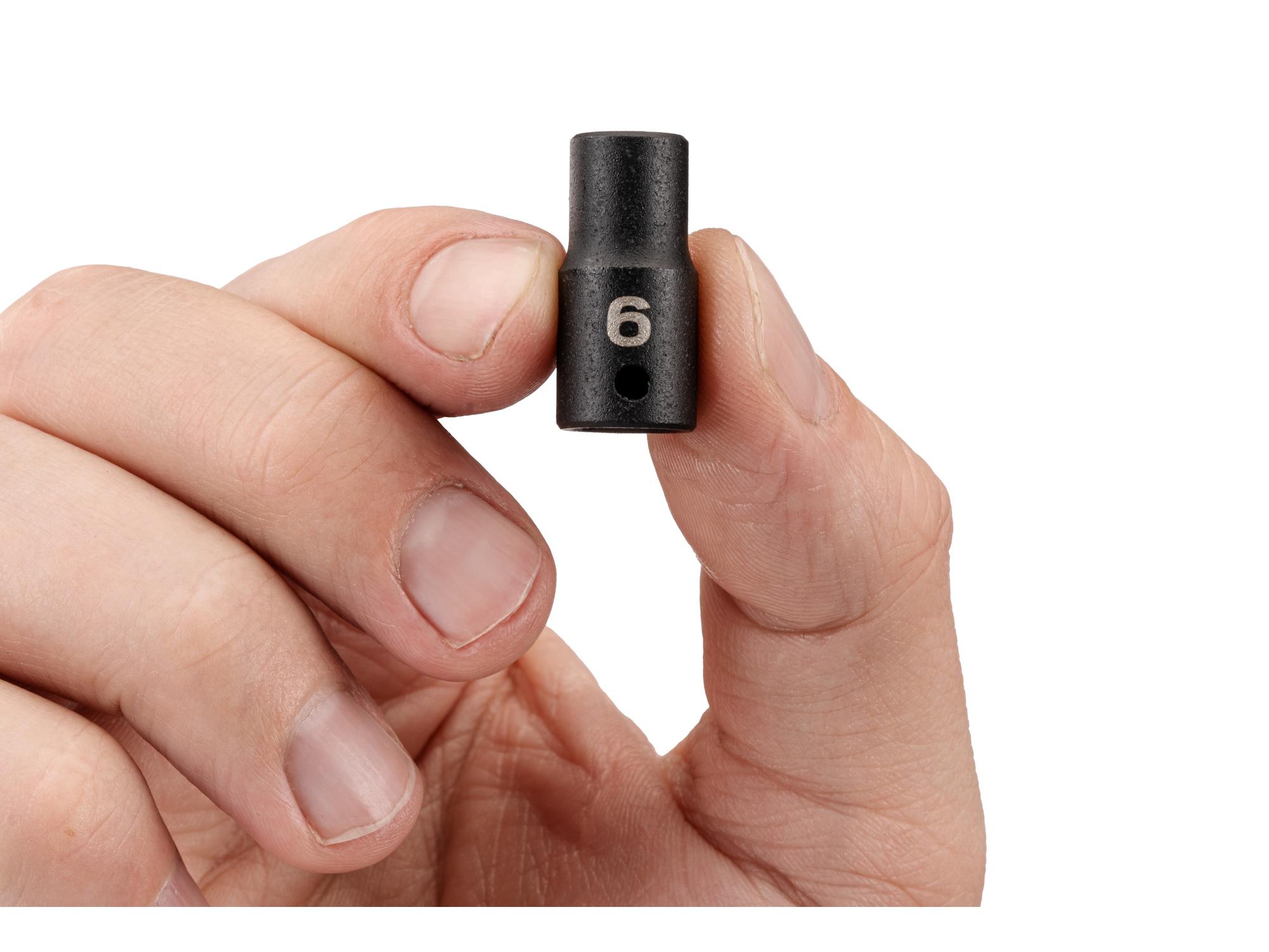 Person holding Tekton impact drive 12-point socket. Item #SID02306