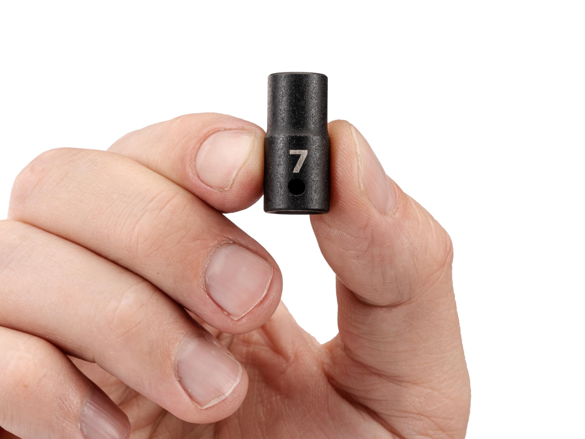 Person holding Tekton impact drive 6-point socket. Item #SID02107
