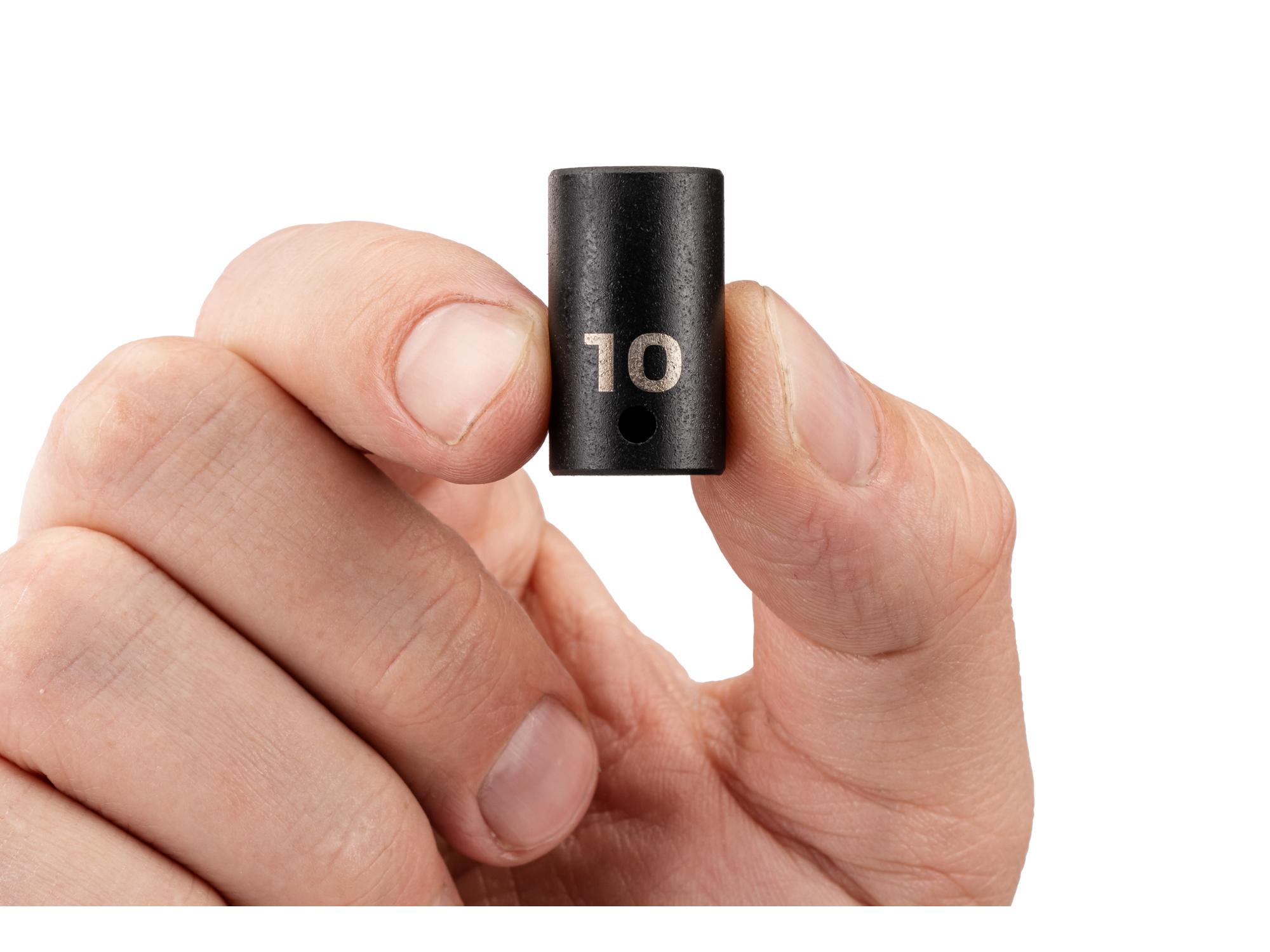 Person holding Tekton impact drive 12-point socket. Item #SID02310