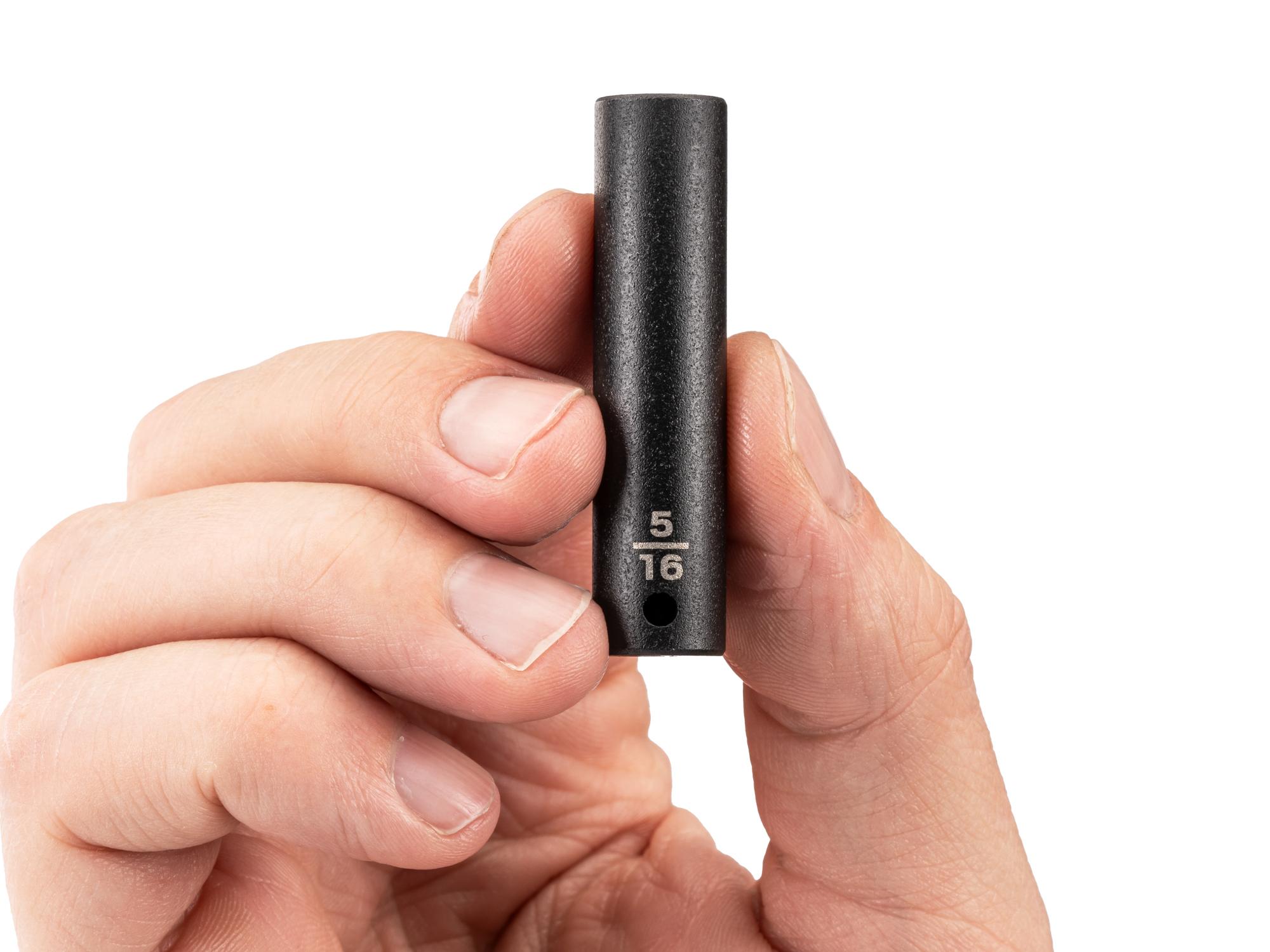 Person holding Tekton impact drive 6-point socket. Item #SID03008