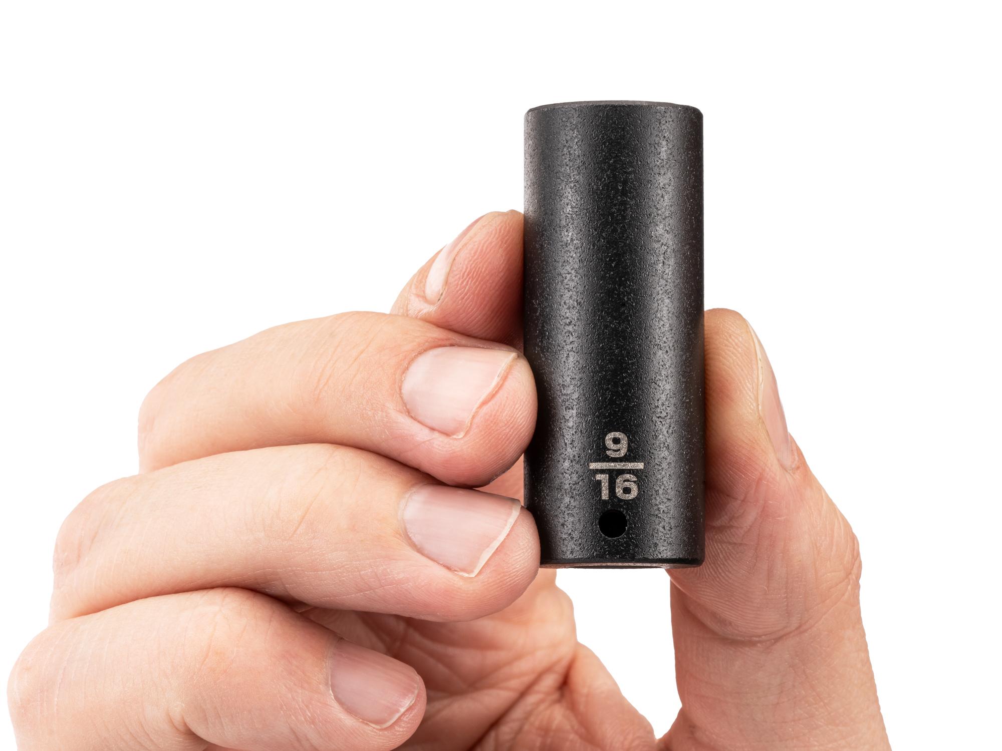 Person holding Tekton impact drive 6-point socket. Item #SID03014