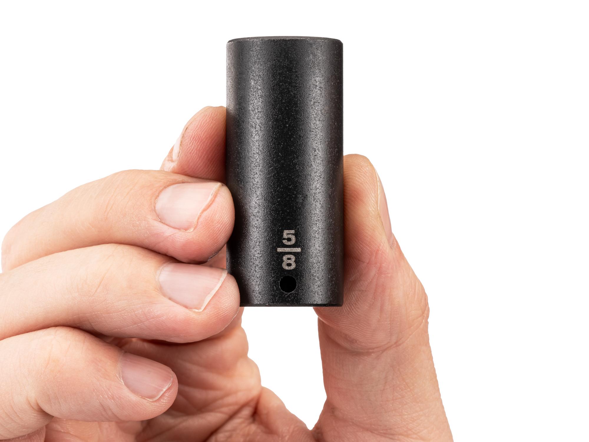 Person holding Tekton impact drive 6-point socket. Item #SID03016