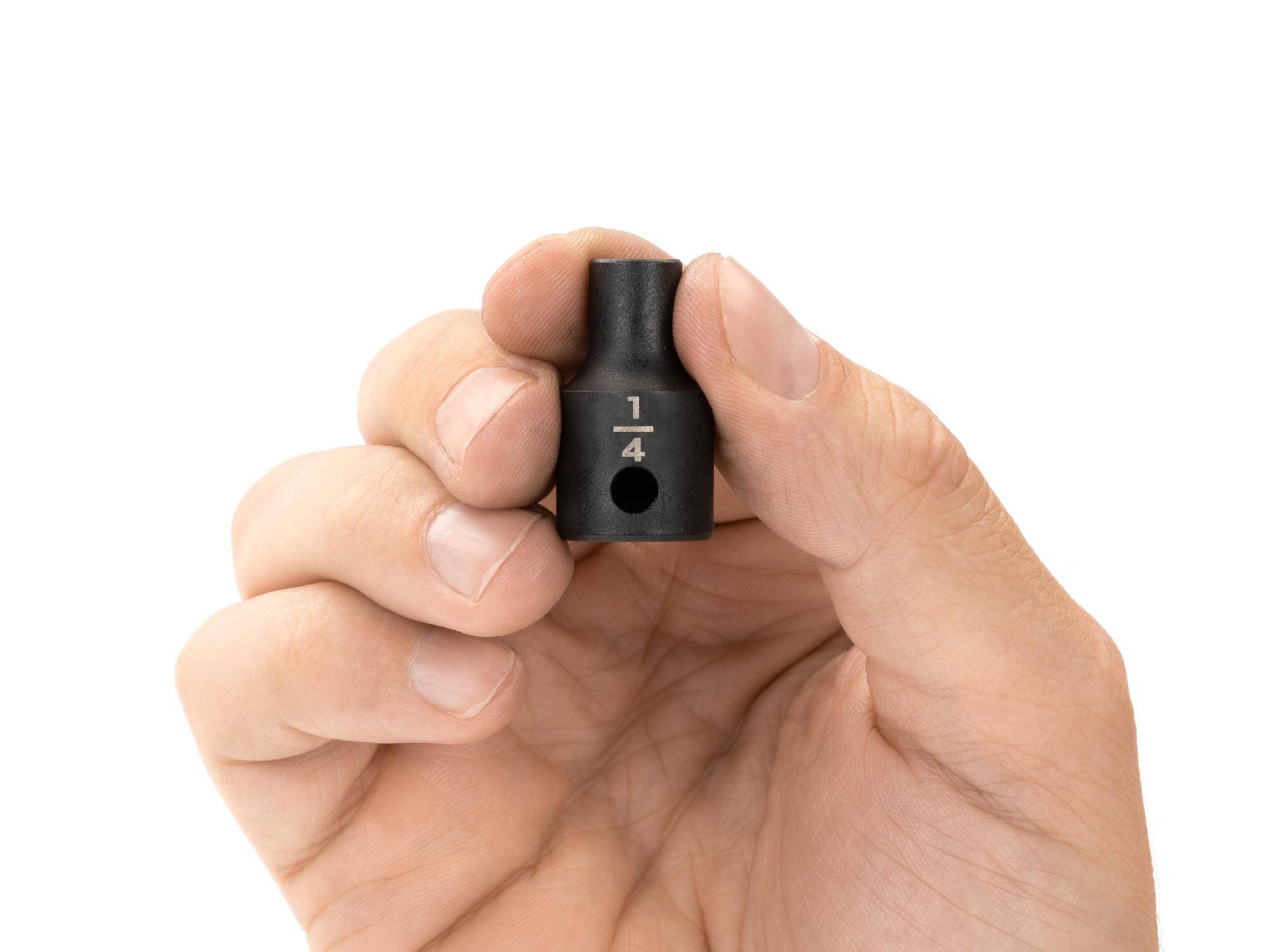 Person holding Tekton impact drive 12-point socket. Item #SID12206
