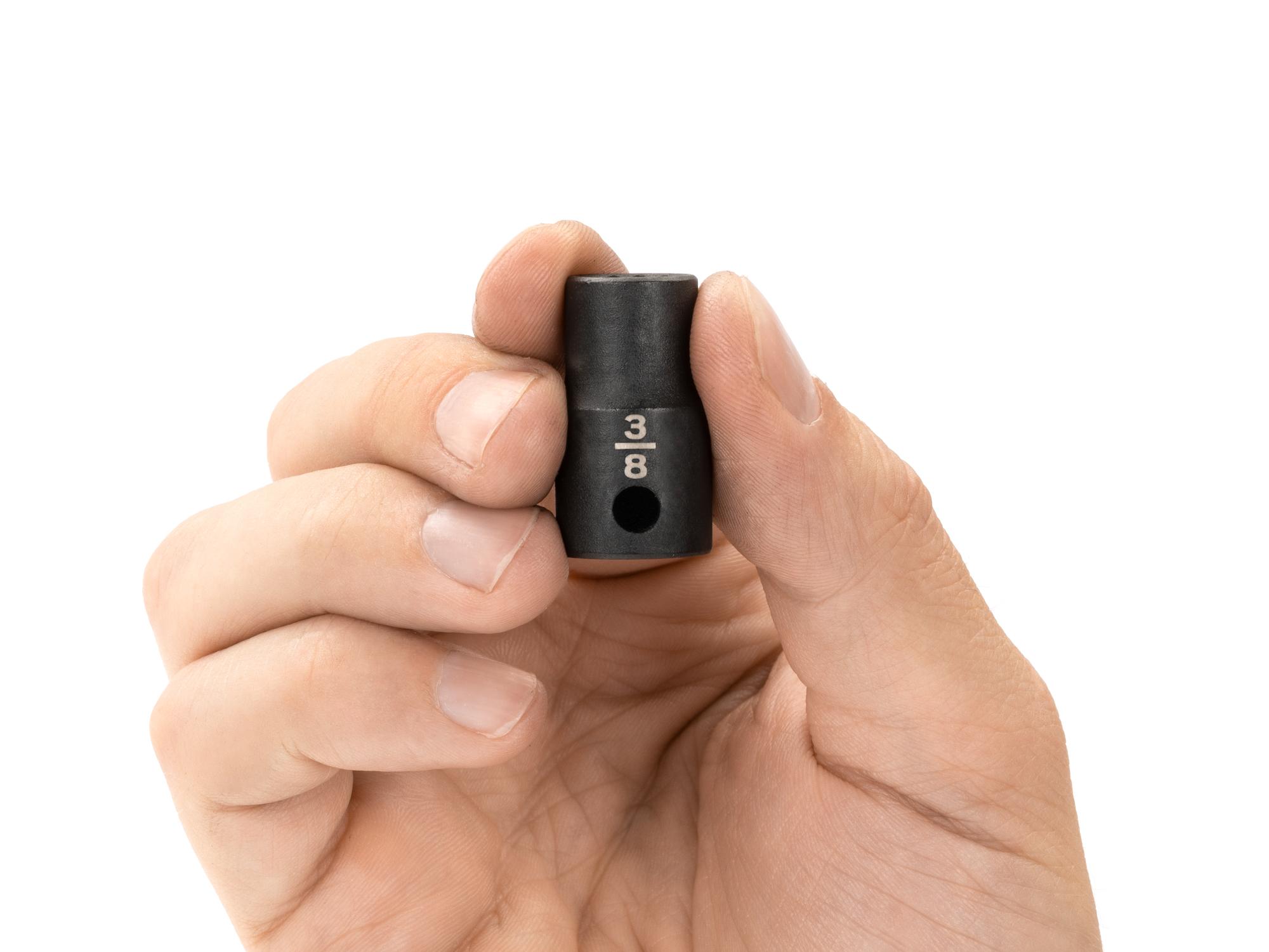 Person holding Tekton impact drive 12-point socket. Item #SID12210