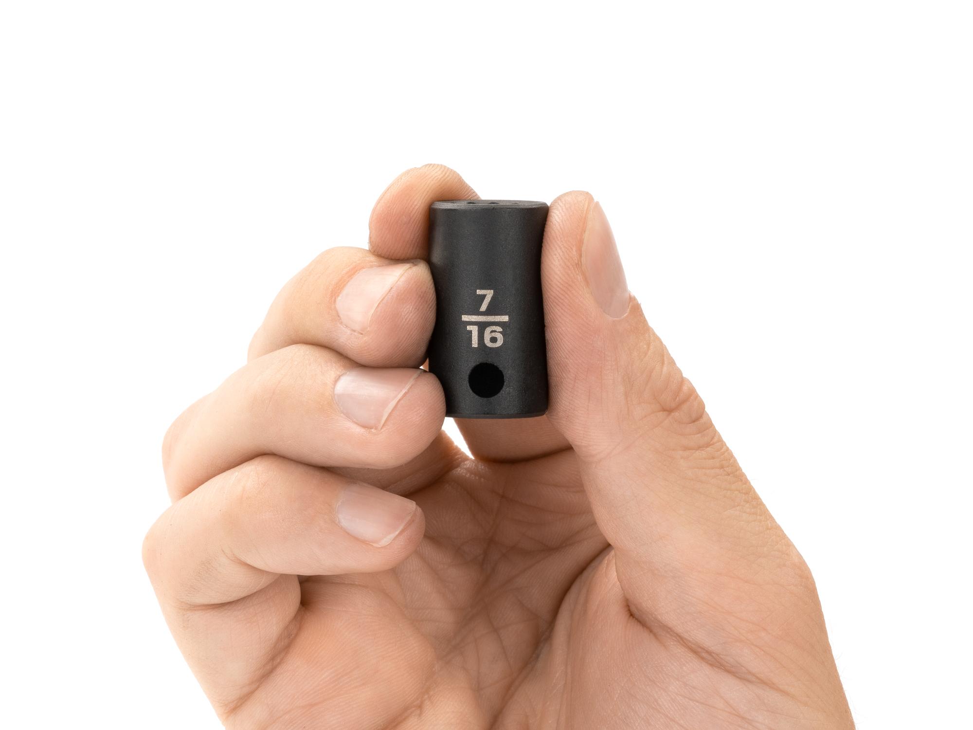 Person holding Tekton impact drive 12-point socket. Item #SID12211
