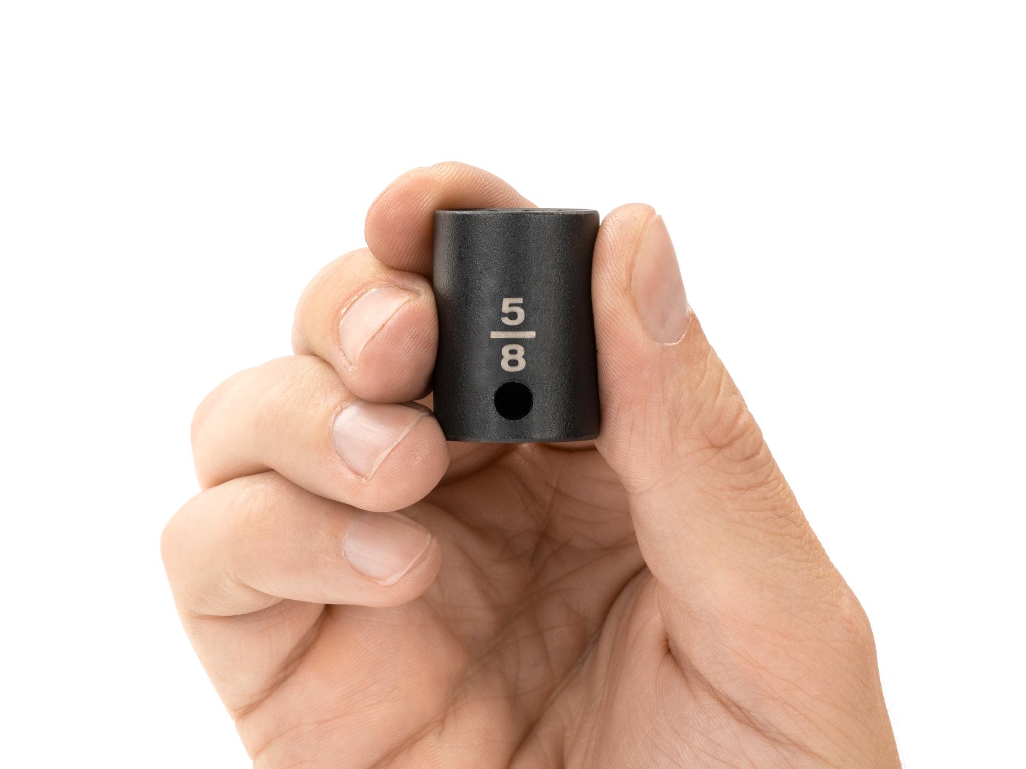 Person holding Tekton impact drive 12-point socket. Item #SID12216