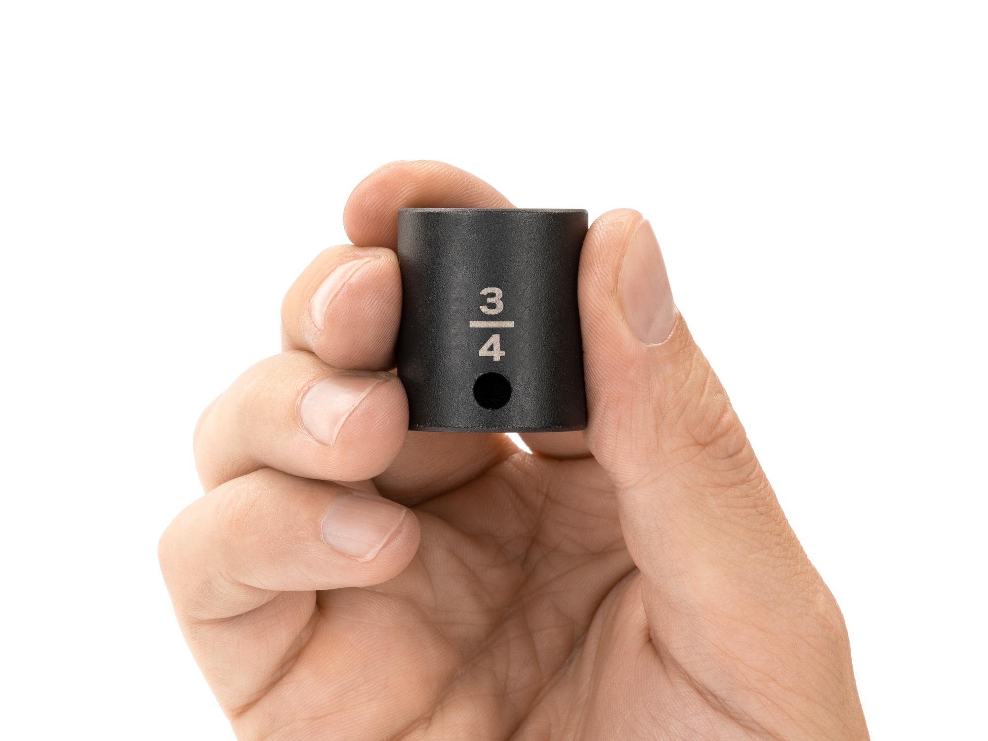 Person holding Tekton impact drive 12-point socket. Item #SID12219