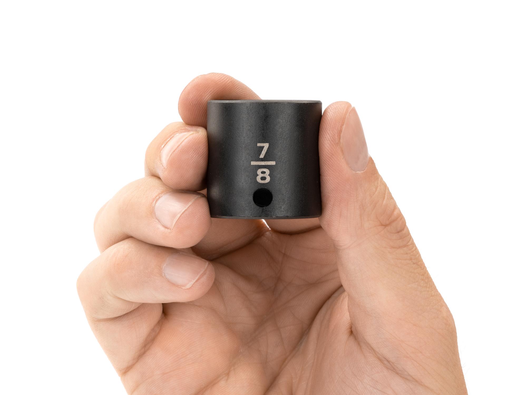 Person holding Tekton impact drive 12-point socket. Item #SID12222