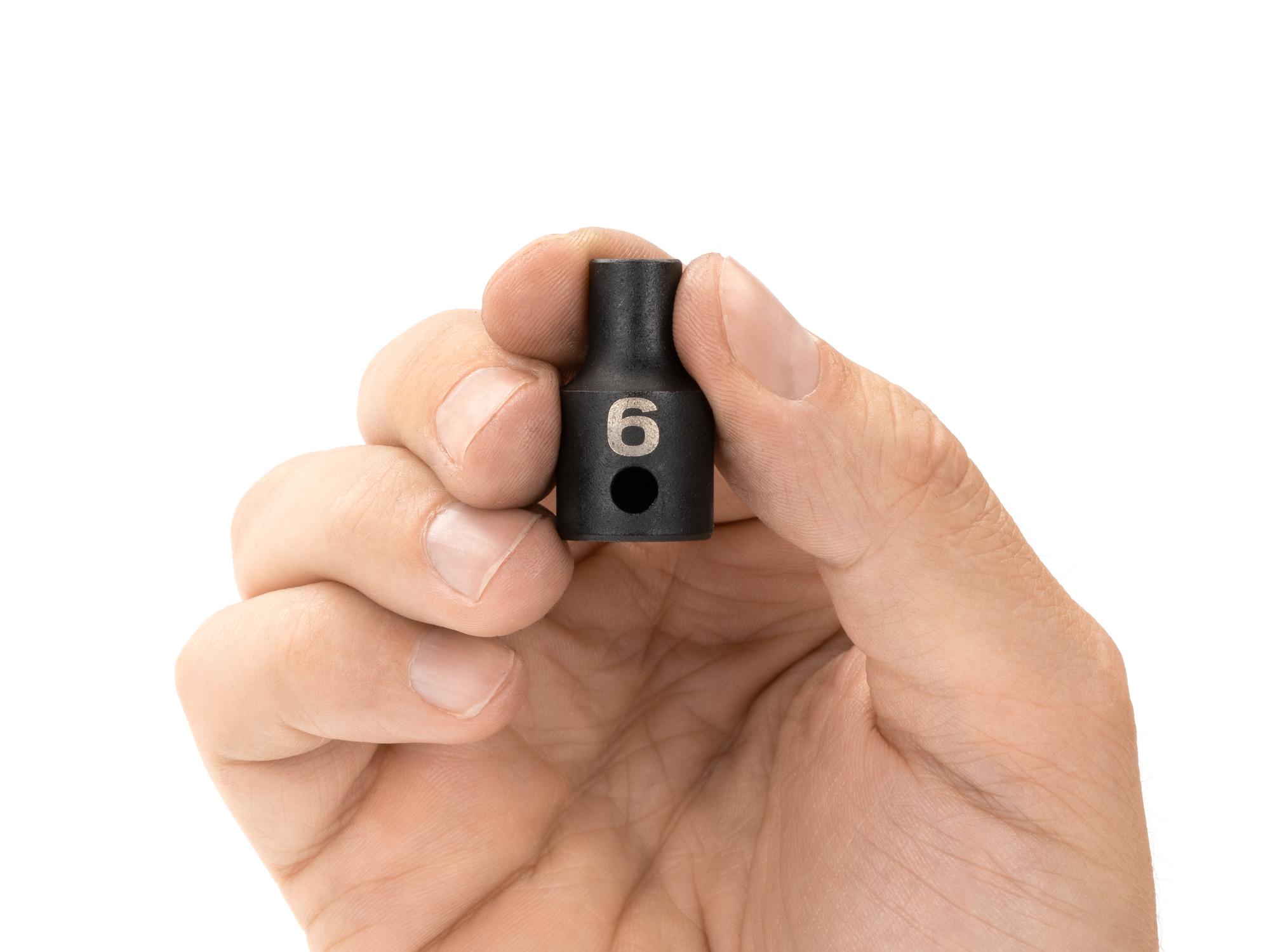 Person holding Tekton impact drive 12-point socket. Item #SID12306