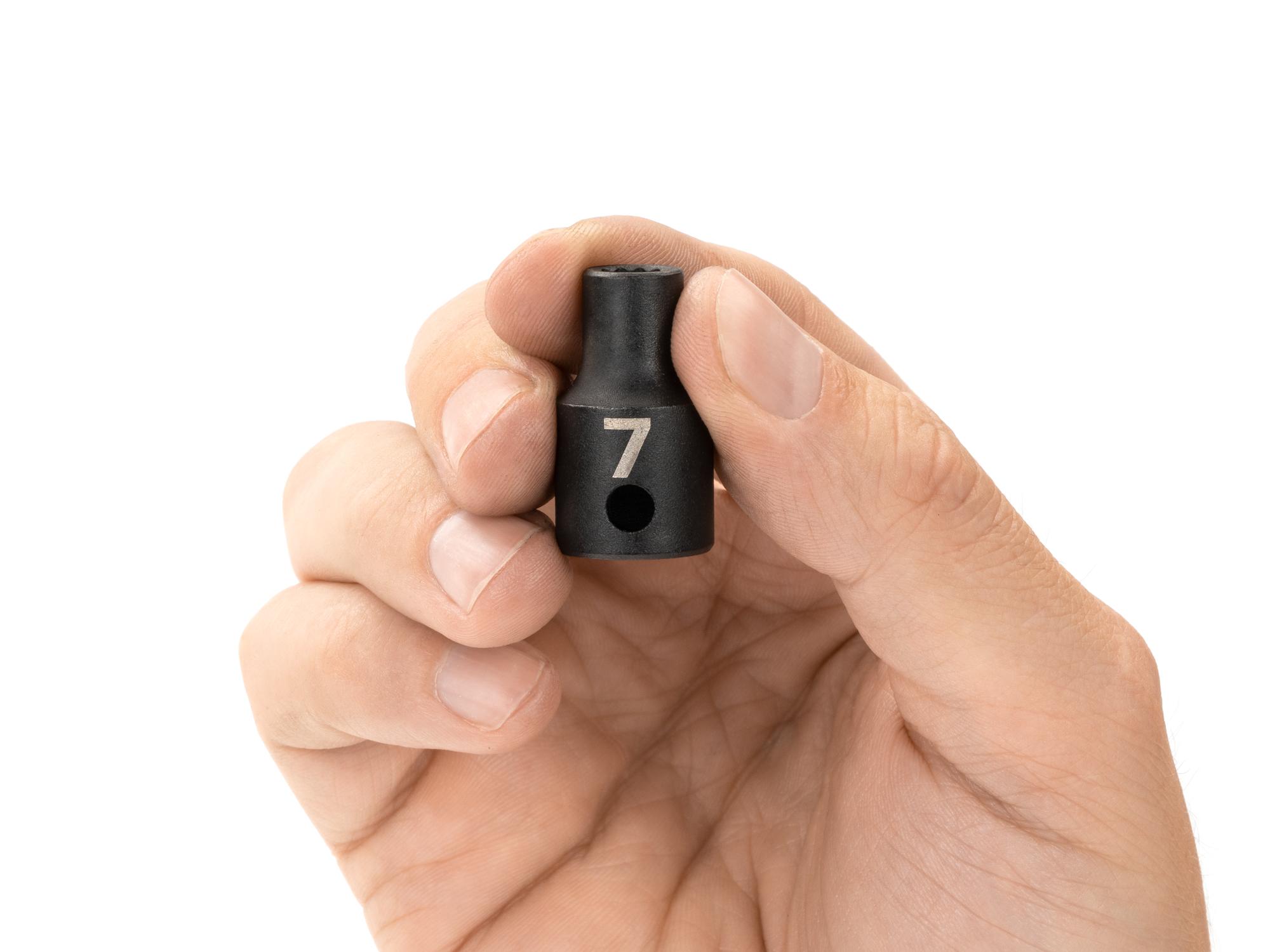 Person holding Tekton impact drive 12-point socket. Item #SID12307