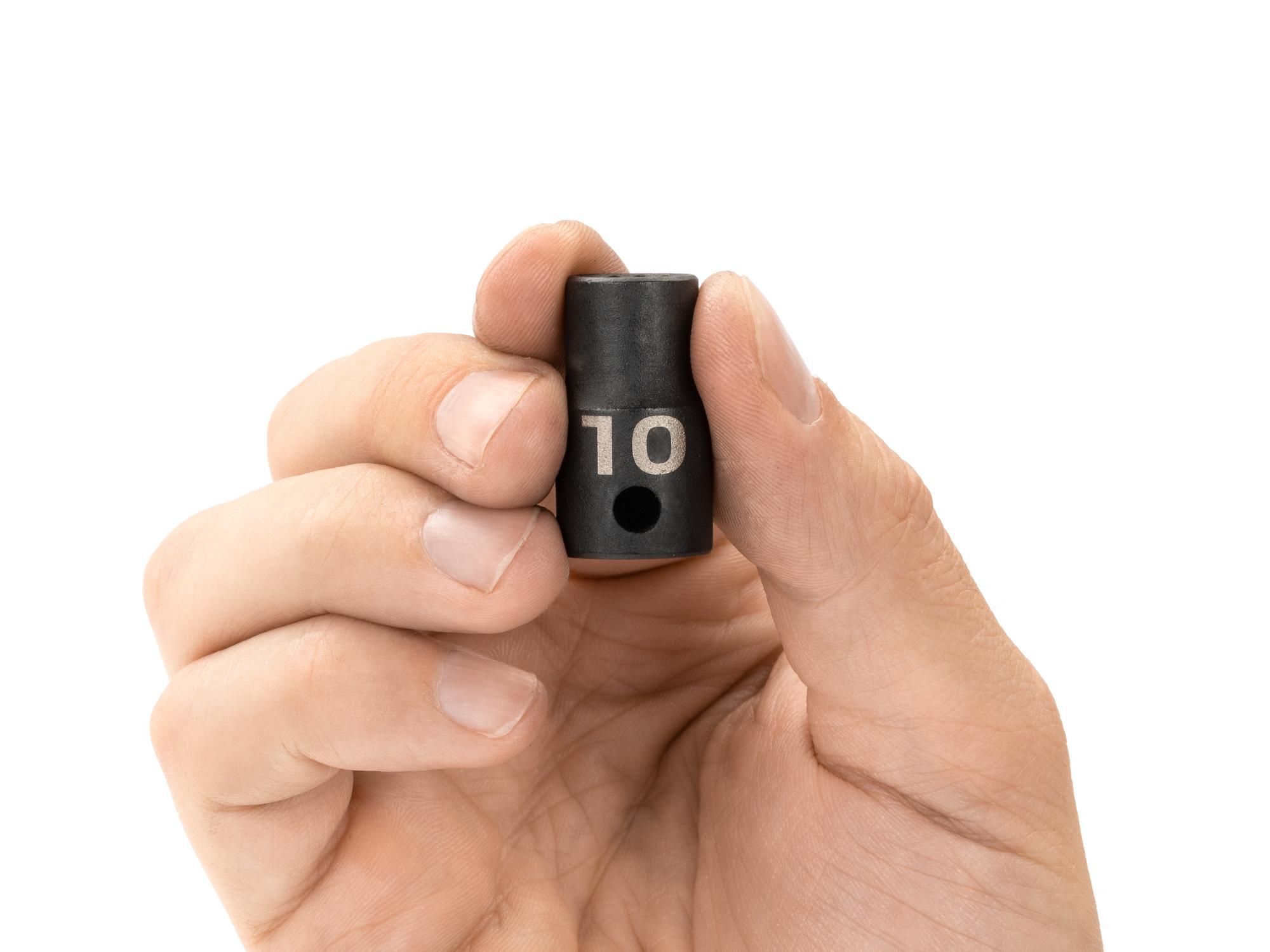 Person holding Tekton impact drive 12-point socket. Item #SID12310