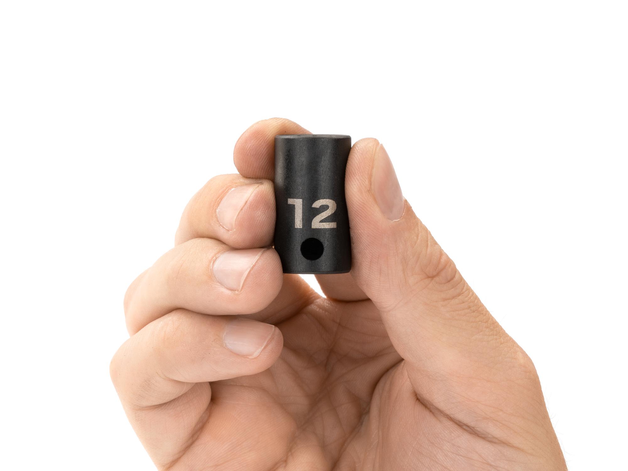 Person holding Tekton impact drive 12-point socket. Item #SID12312