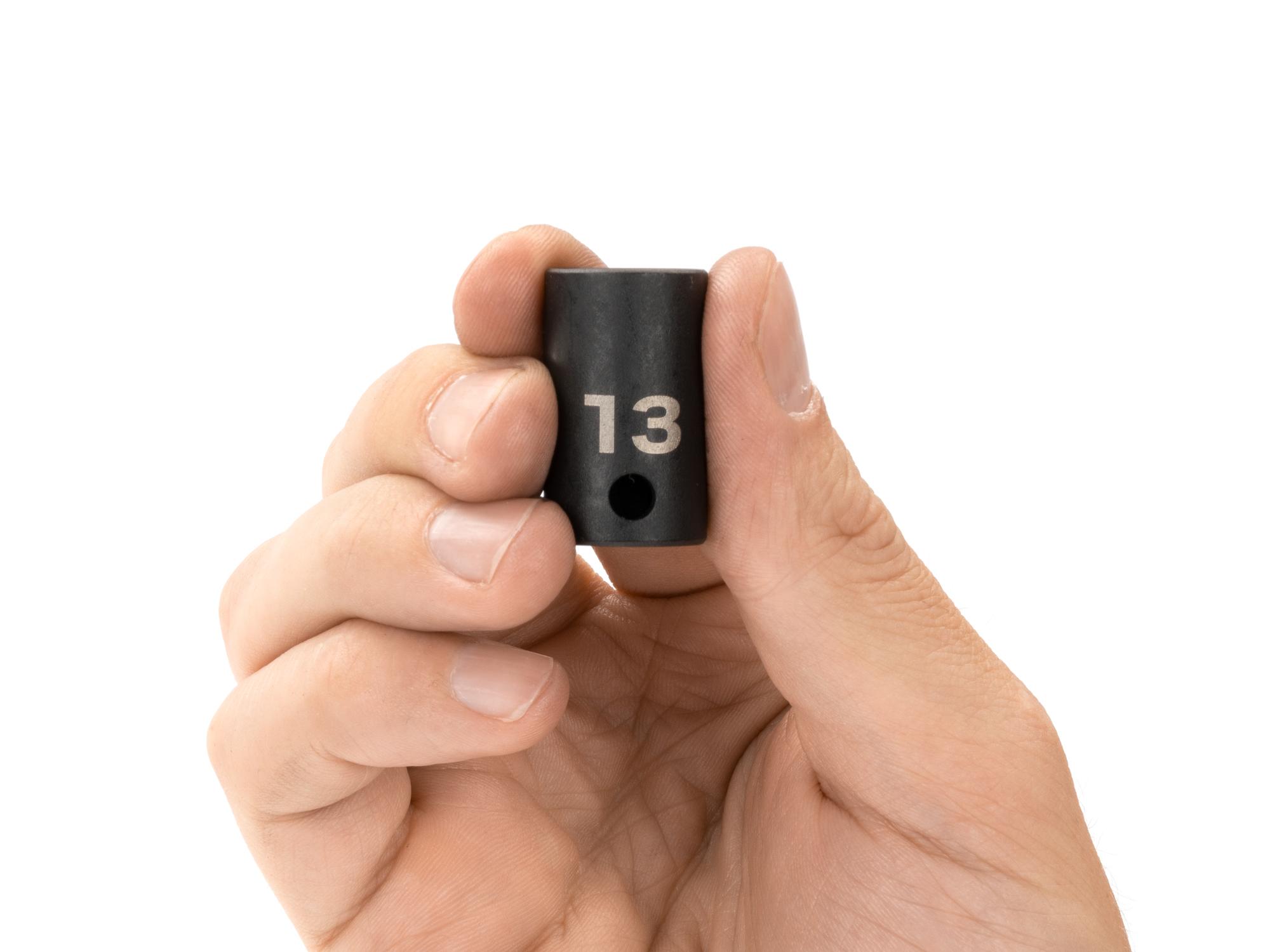 Person holding Tekton impact drive 12-point socket. Item #SID12313