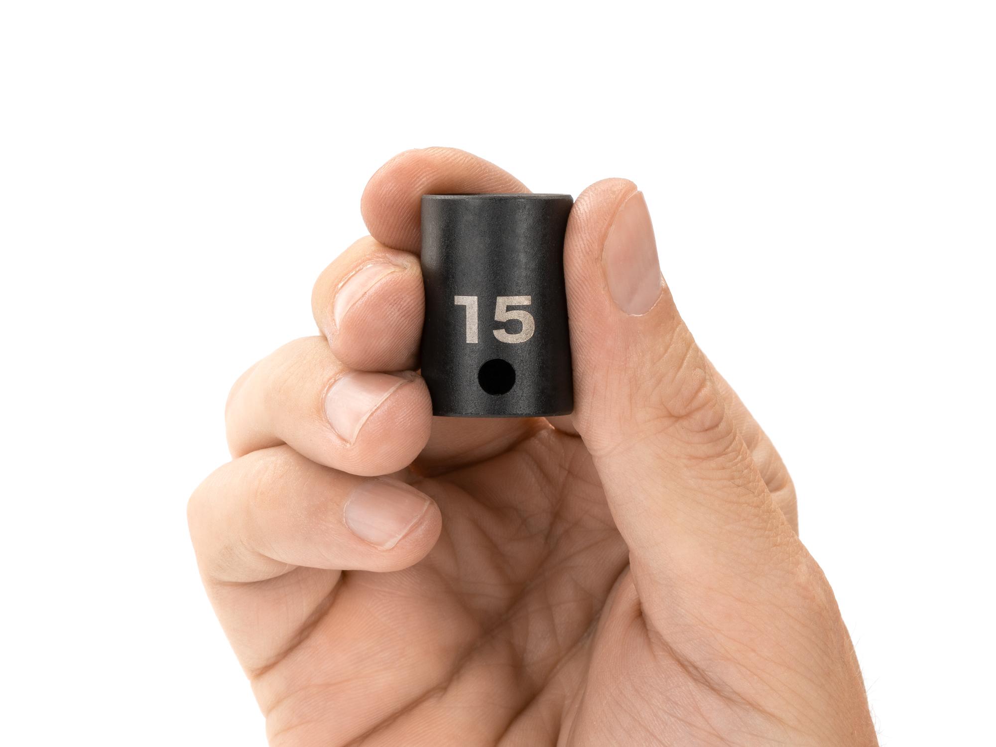 Person holding Tekton impact drive 12-point socket. Item #SID12315