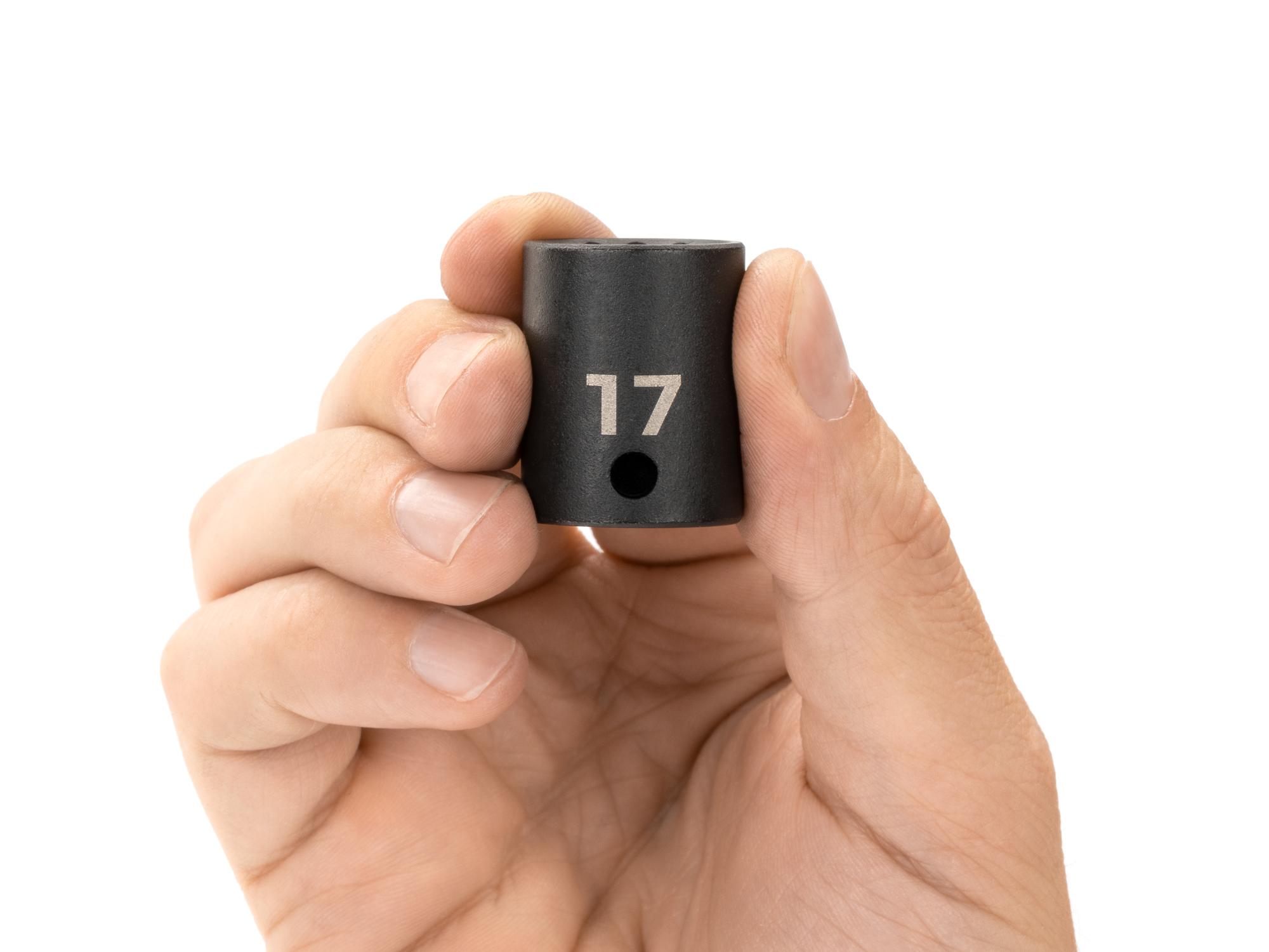 Person holding Tekton impact drive 12-point socket. Item #SID12317