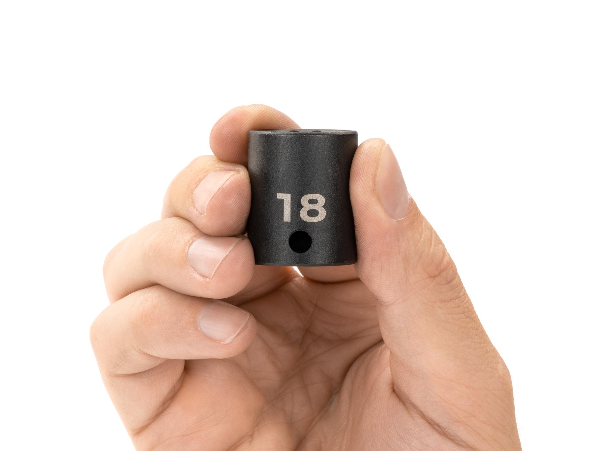 Person holding Tekton impact drive 12-point socket. Item #SID12318