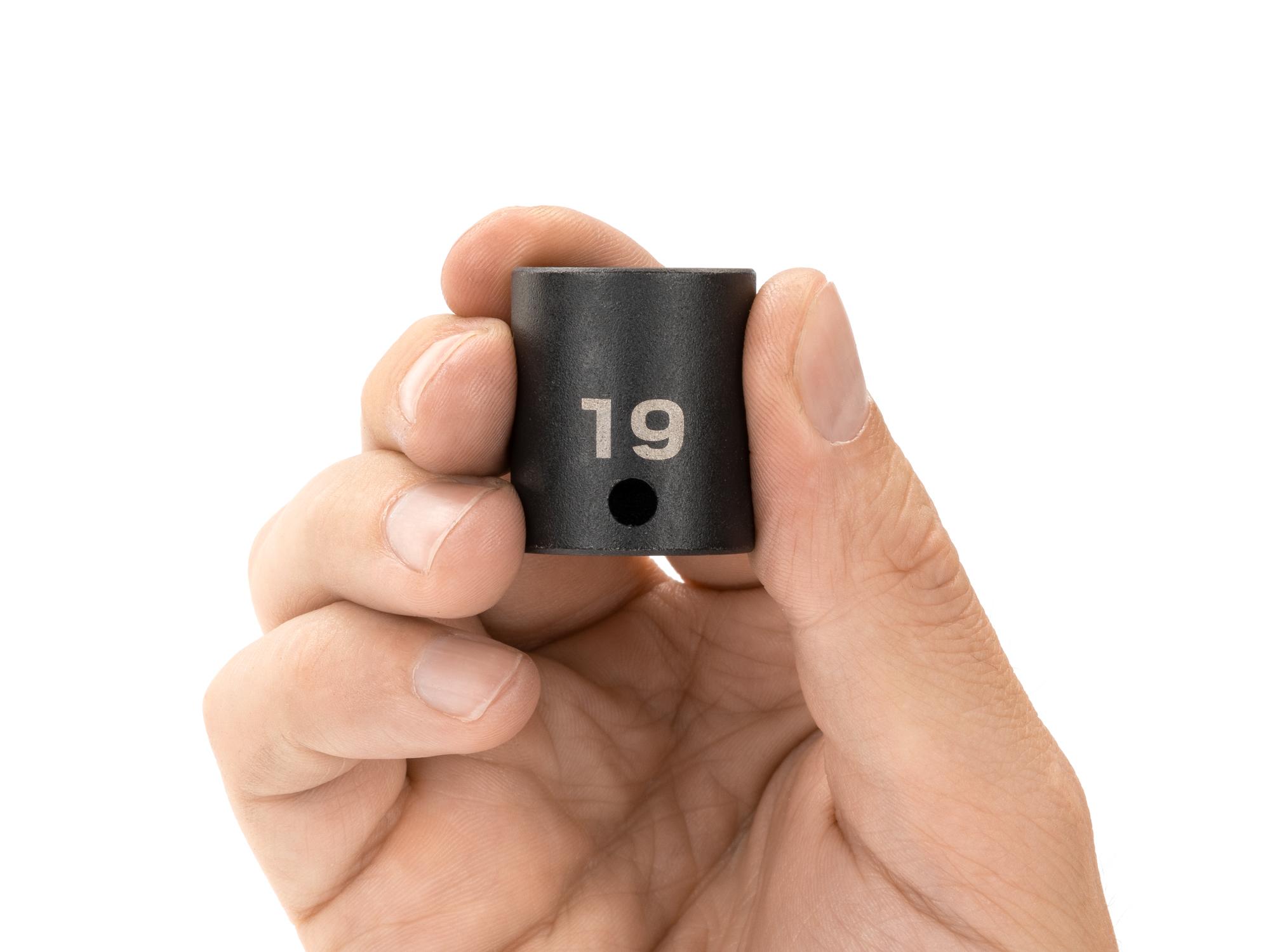 Person holding Tekton impact drive 12-point socket. Item #SID12319