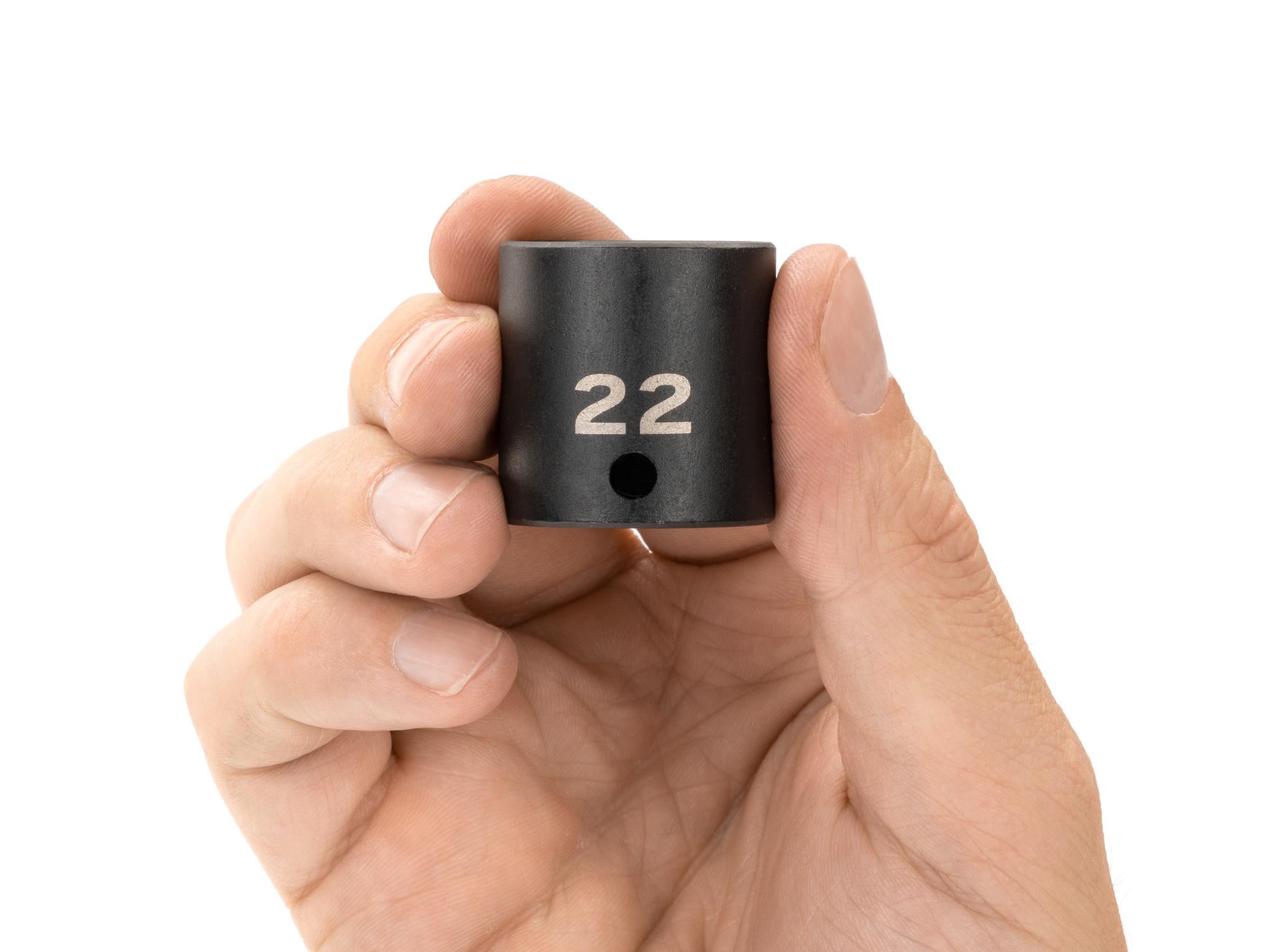 Person holding Tekton impact drive 12-point socket. Item #SID12322