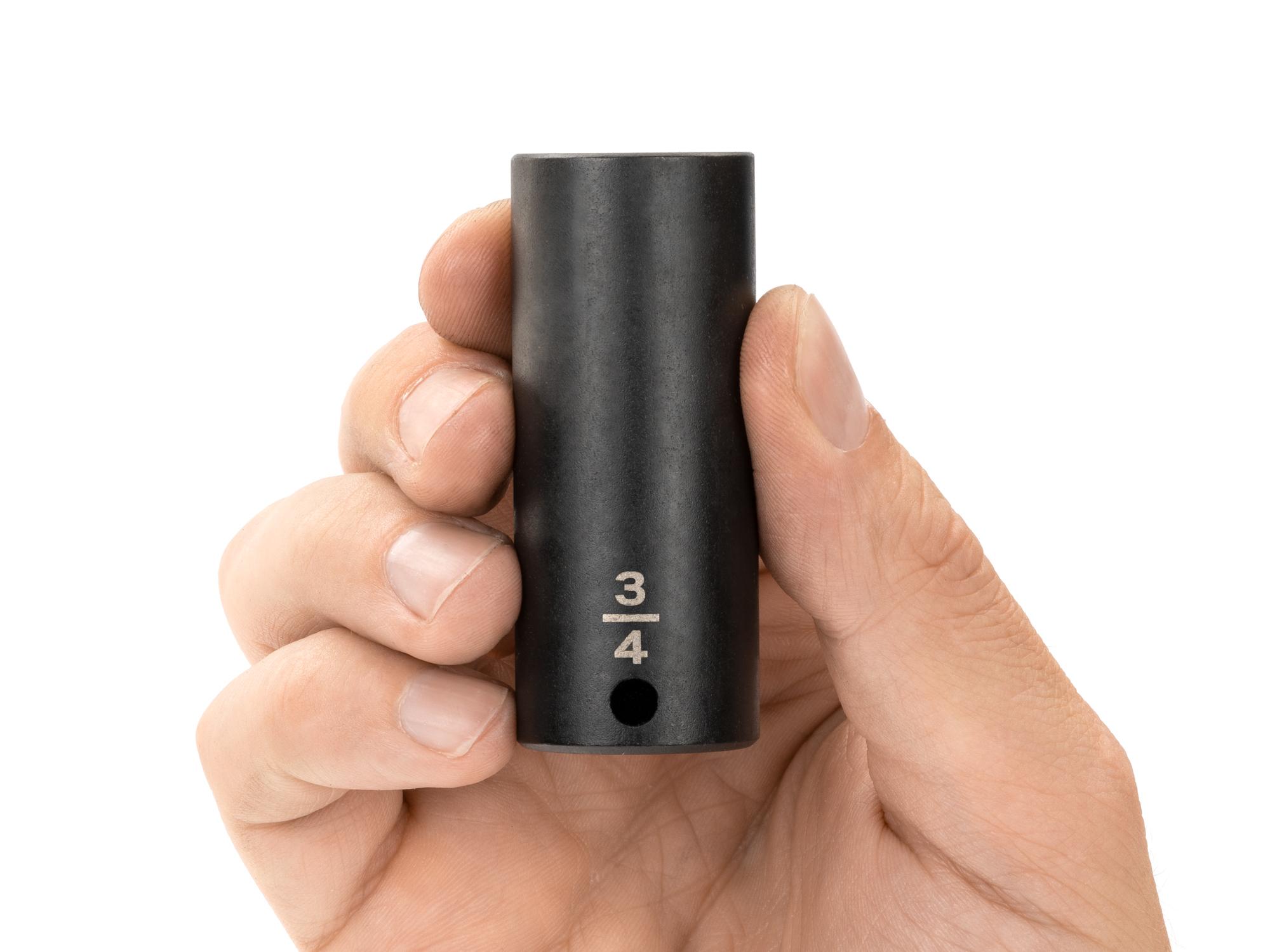 Person holding Tekton impact drive 12-point socket. Item #SID13219