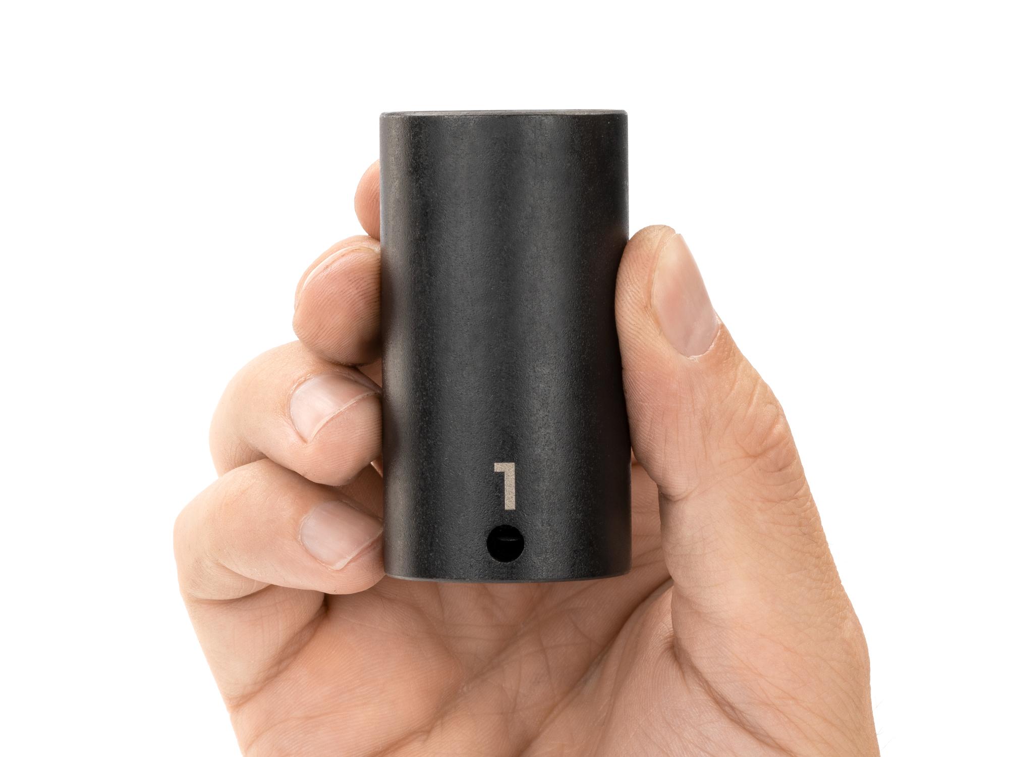 Person holding Tekton impact drive 12-point socket. Item #SID13225