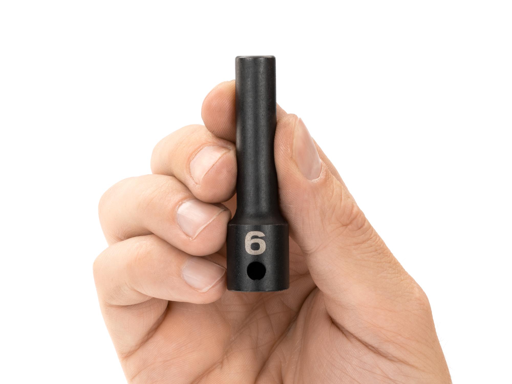 Person holding Tekton impact drive 12-point socket. Item #SID13306